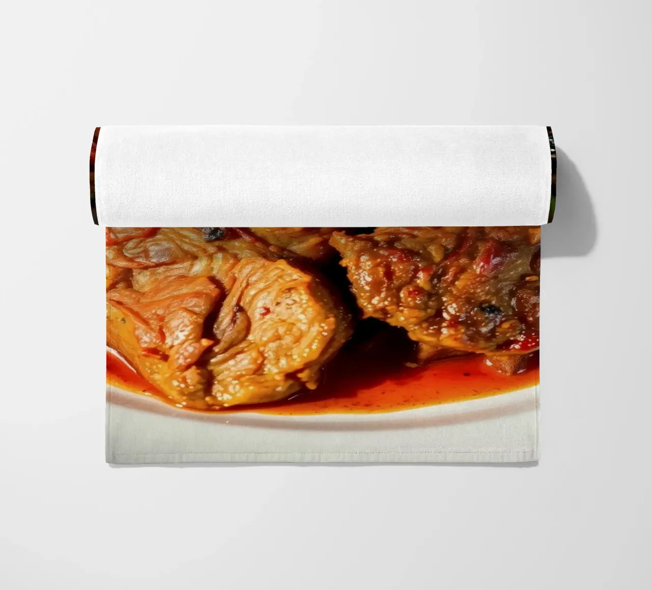 Savory slow-cooked beef stew with herbs and vegetables beach towel by DesignDoodle