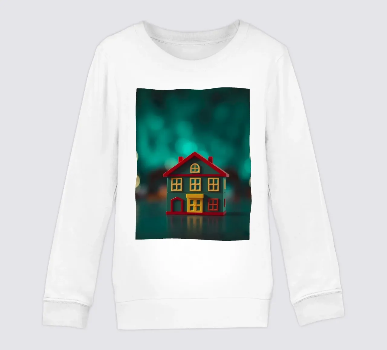 Casa giocattolo colorata su un tavolo con luci soffuse e sfocate felpa bambino da DesignDoodle