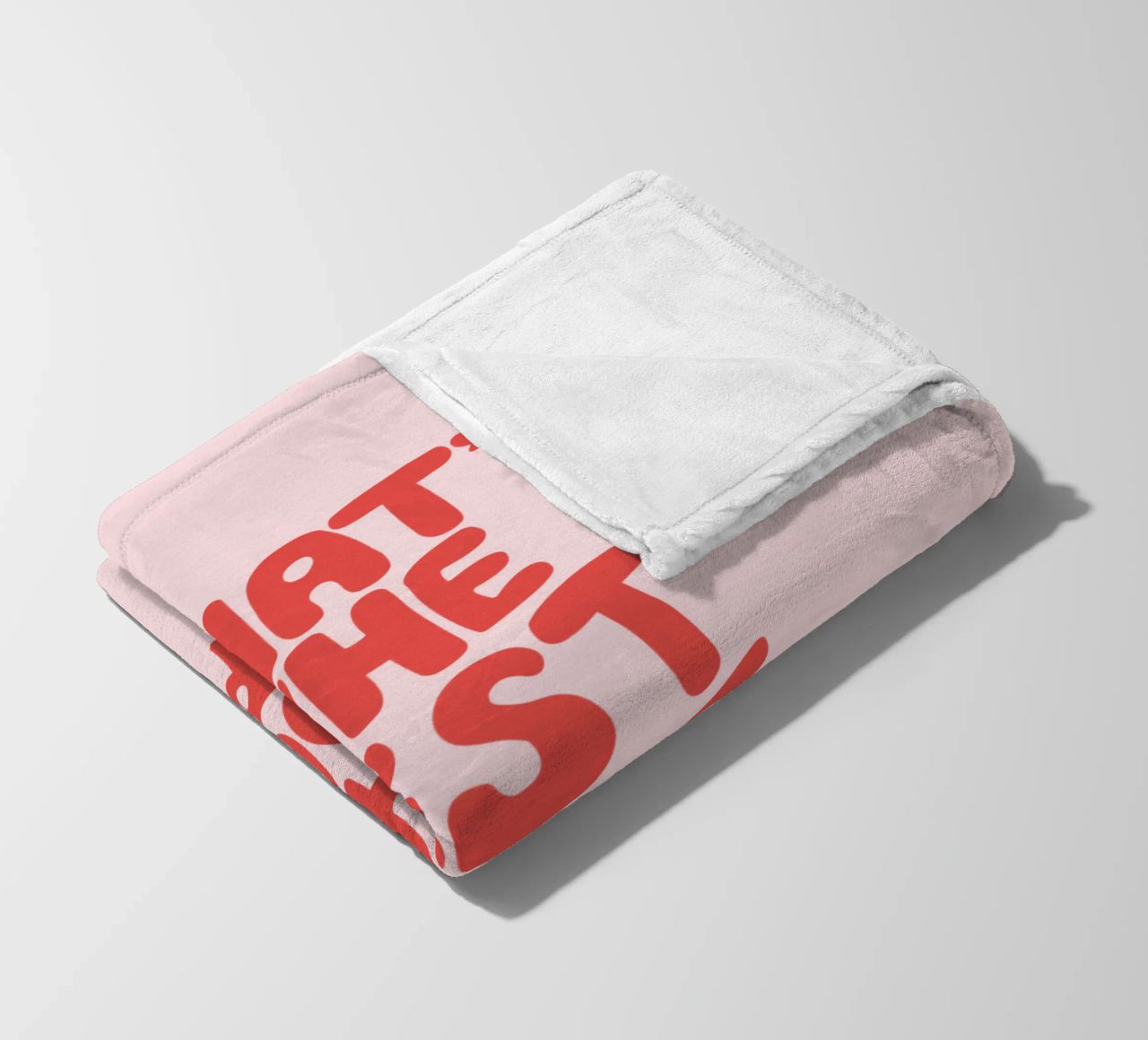 Tipografia "What's The Best That Could Happen" in rosso e inchiostro coperta in pile da THE MOTIVATED TYPE