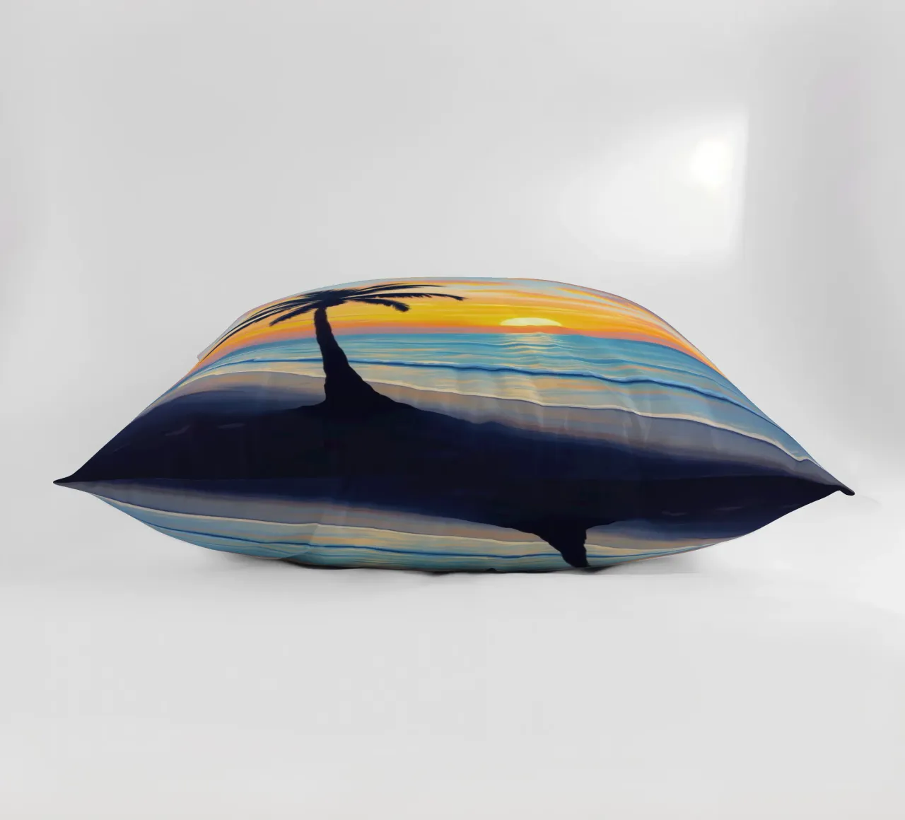 Sunset over the ocean with a lone palm tree on a beach decorative cushion by DesignDoodle