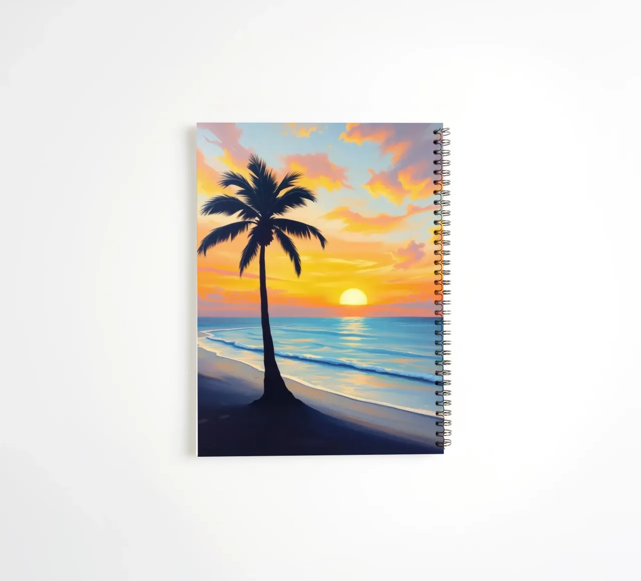Sunset over the ocean with a lone palm tree on a beach spiral notebook by DesignDoodle
