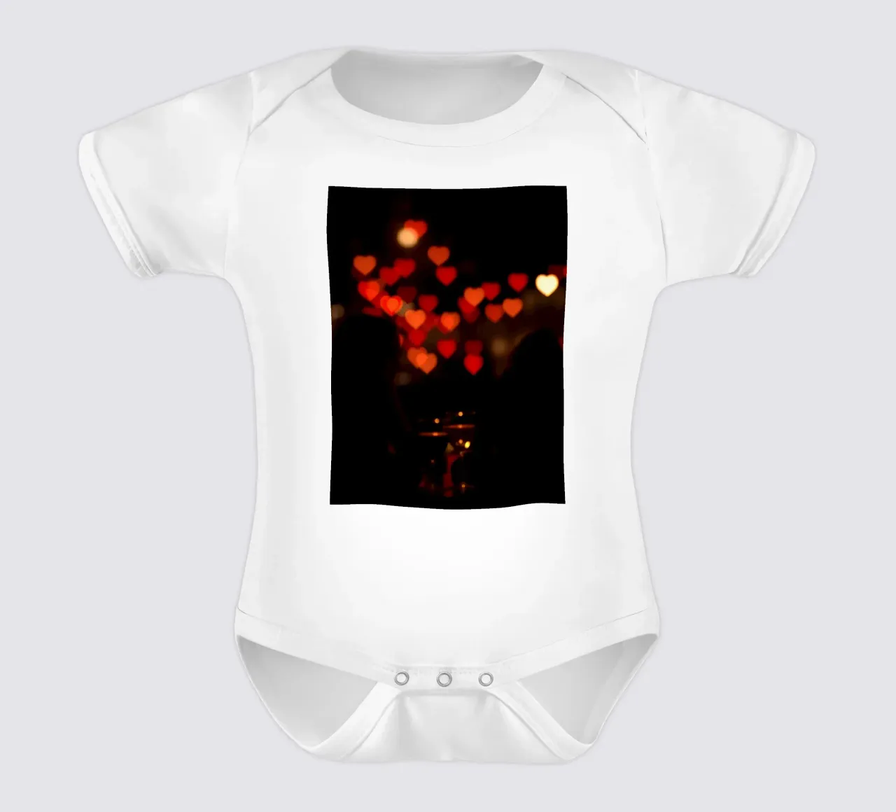 Romantic evening with heart-shaped lights in the background short-sleeve baby romper by DesignDoodle