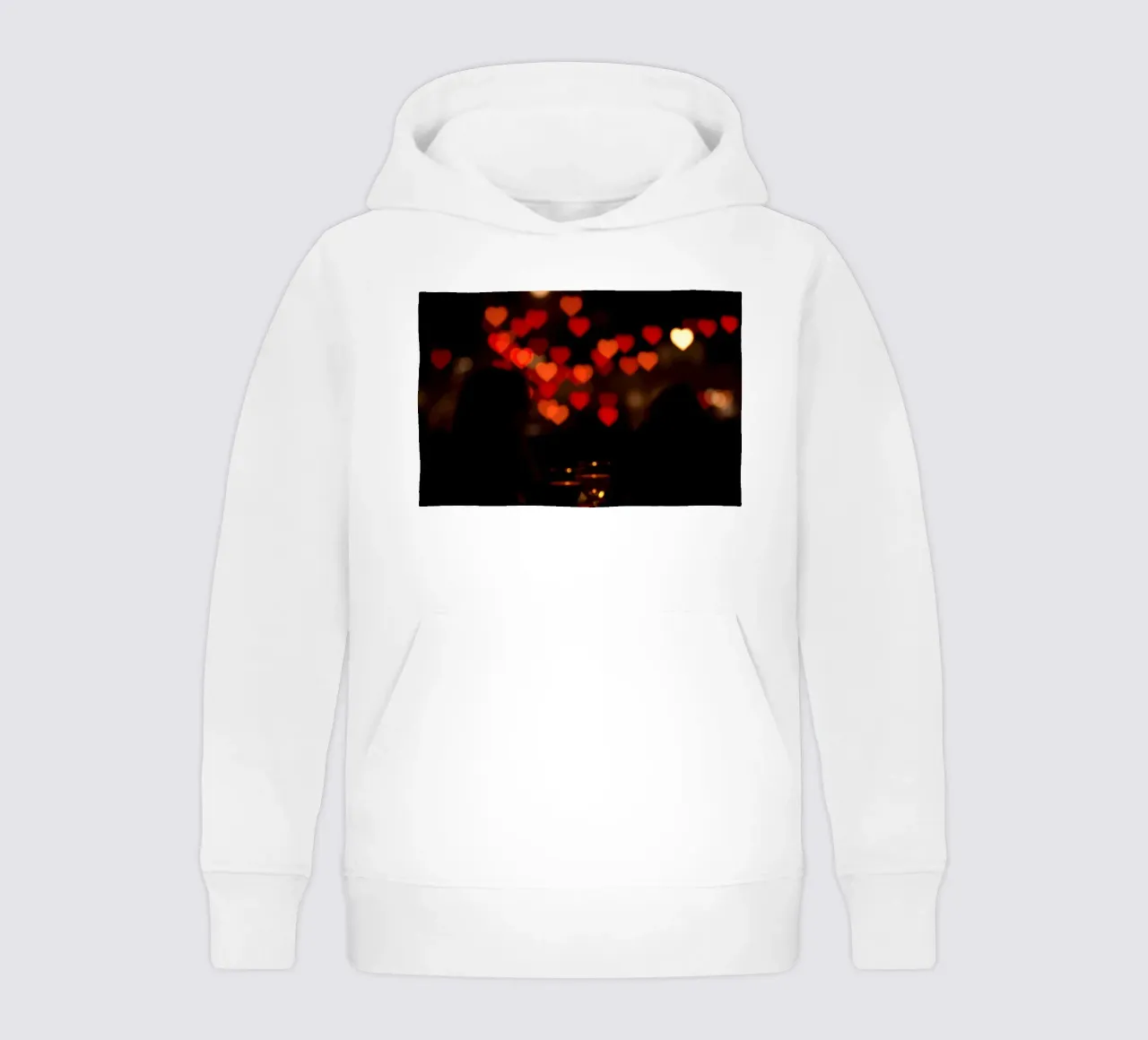 Romantic evening with heart-shaped lights in the background kids hoodie by DesignDoodle