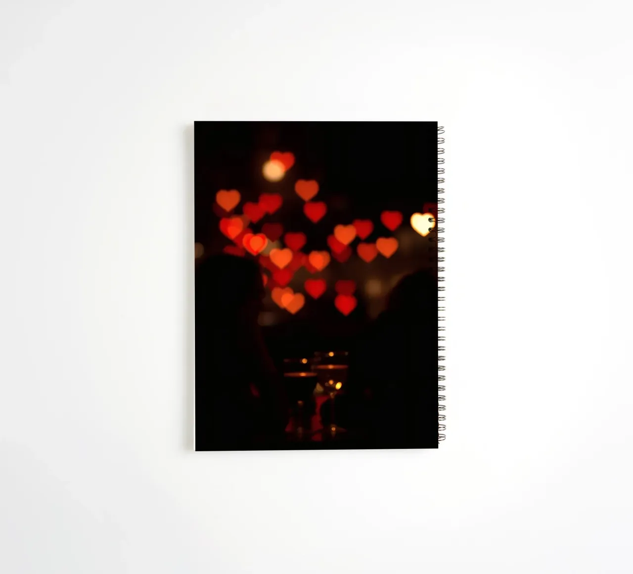Romantic evening with heart-shaped lights in the background spiral notebook by DesignDoodle