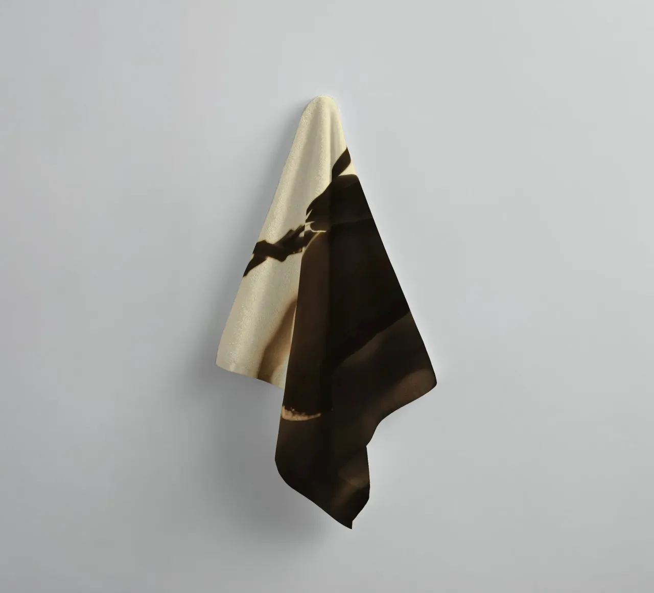 Sunlight filters through leaves highlighting a single orange towel by DesignDoodle