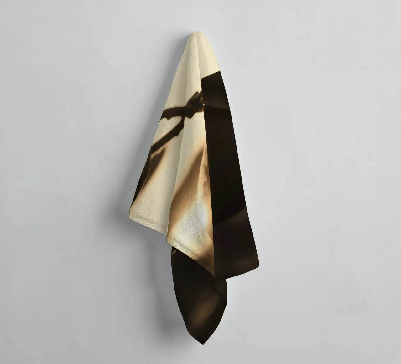Sunlight filters through leaves highlighting a single orange towel by DesignDoodle