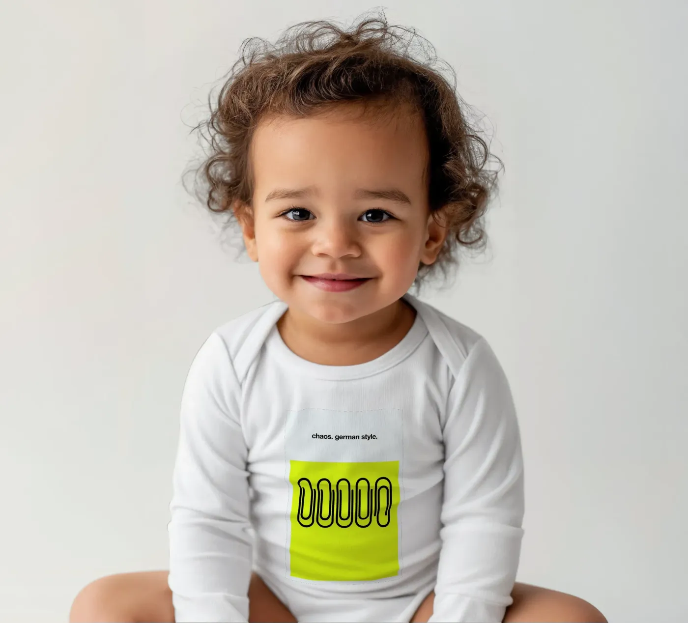 German Chaos long-sleeve baby romper by Kubistika