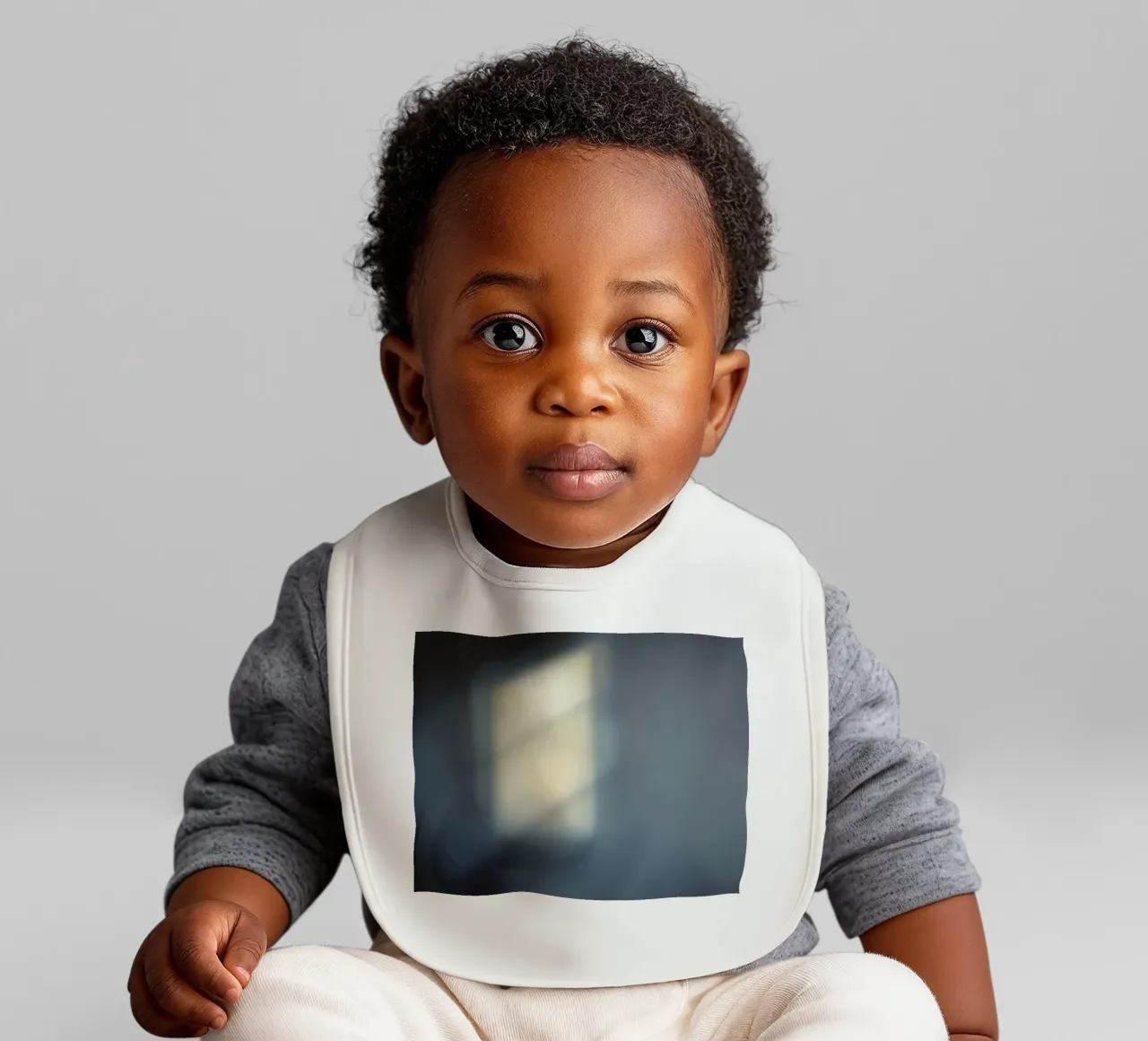 Soft light filters through a window, creating a hazy ambianc baby bib by DesignDoodle