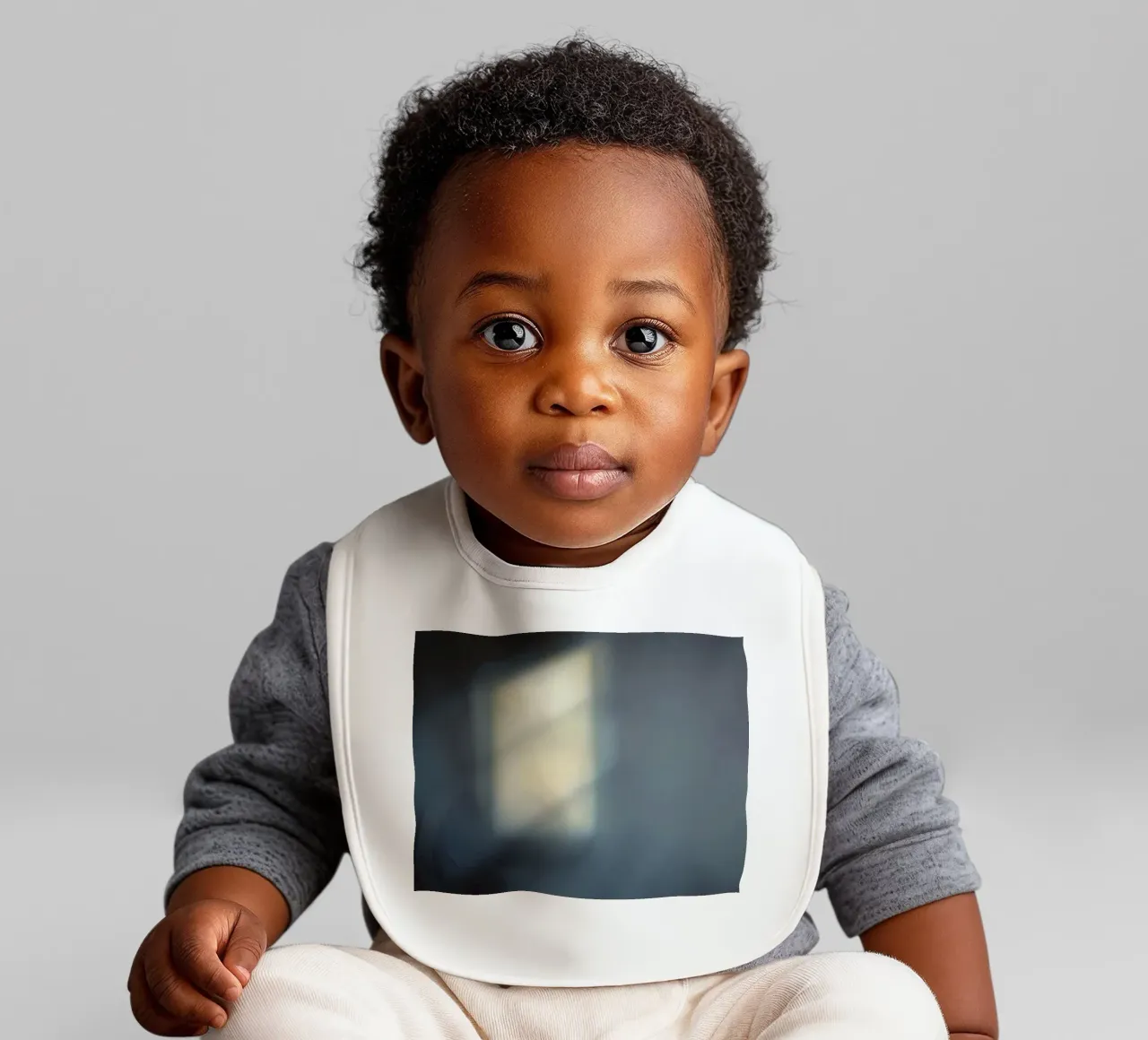 Soft light filters through a window, creating a hazy ambianc baby bib by DesignDoodle