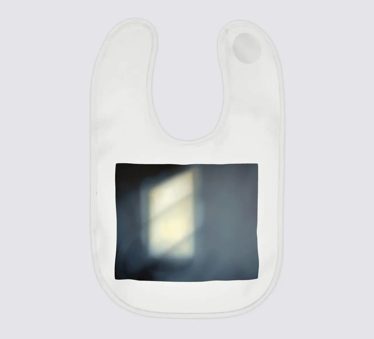 Soft light filters through a window, creating a hazy ambianc baby bib by DesignDoodle
