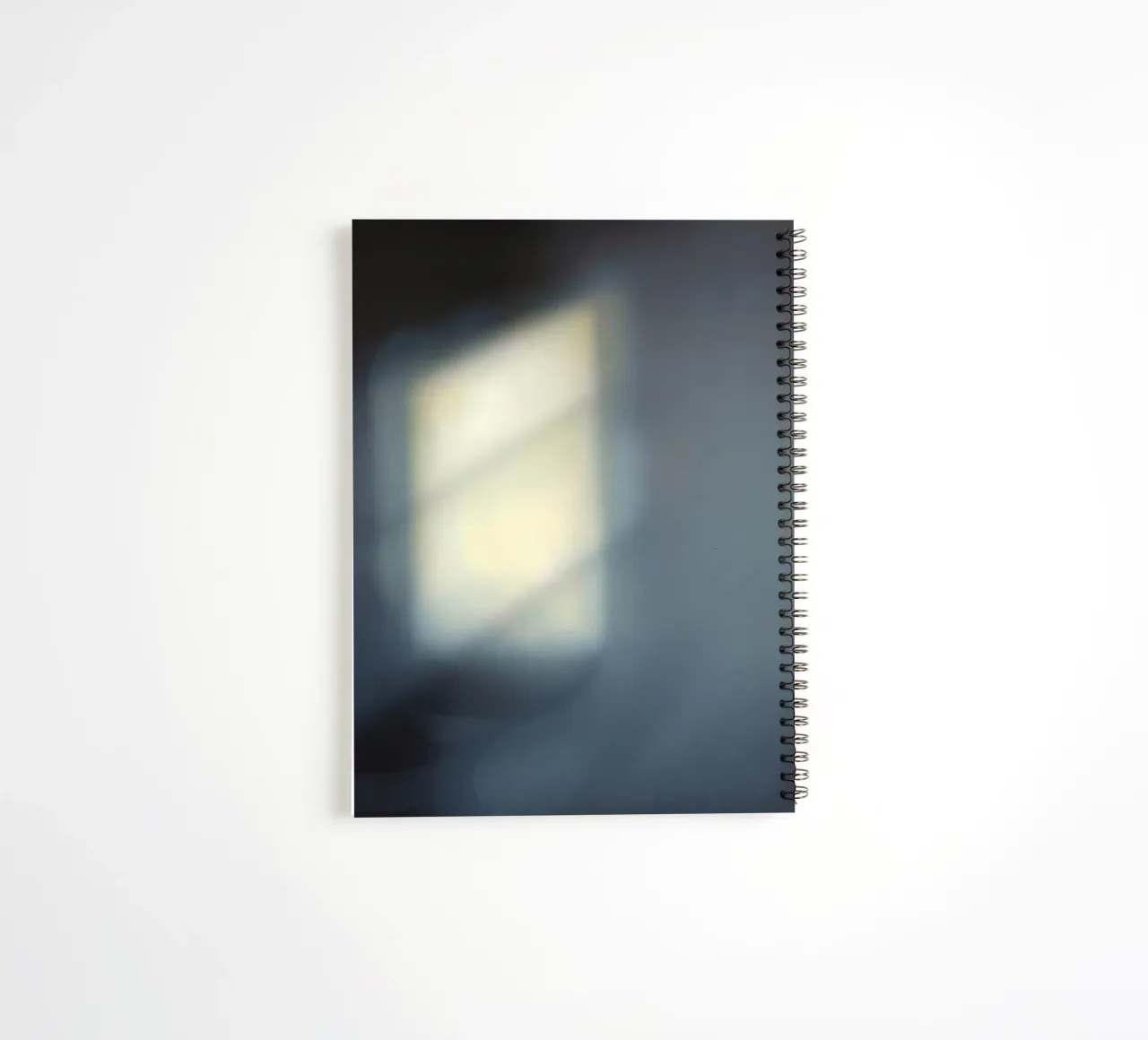 Soft light filters through a window, creating a hazy ambianc spiral notebook by DesignDoodle