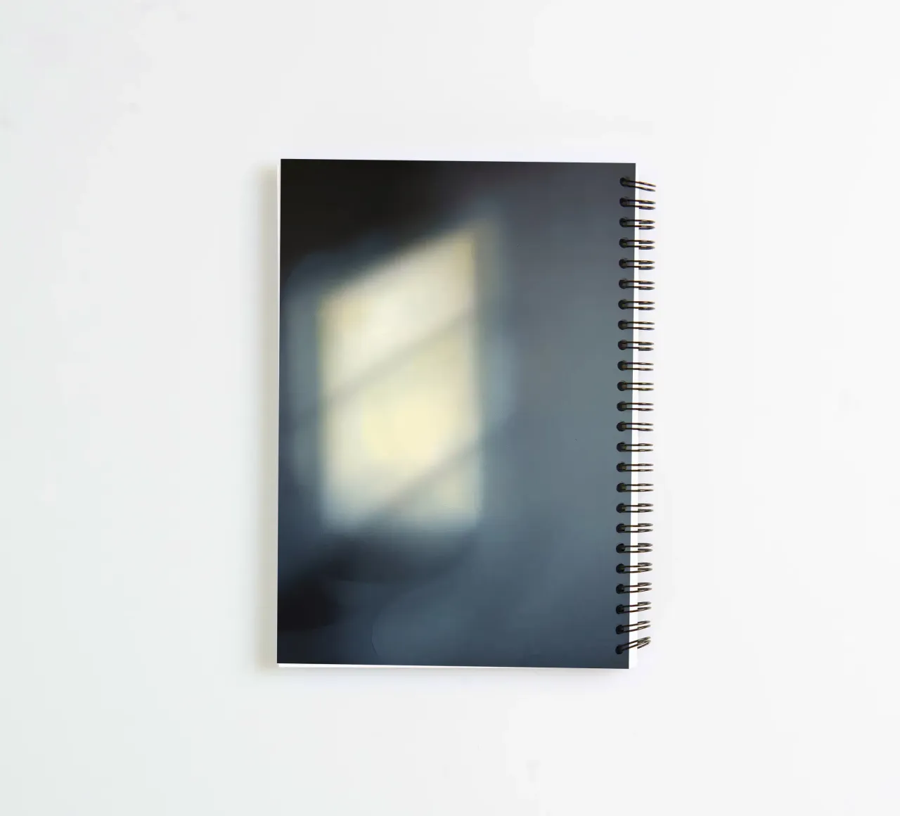 Soft light filters through a window, creating a hazy ambianc spiral notebook by DesignDoodle