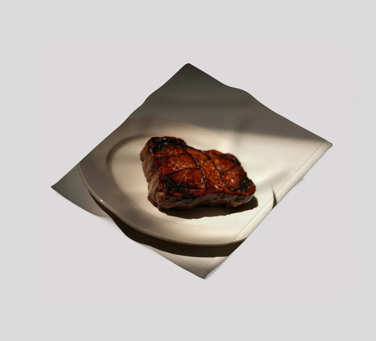 Bistecca perfettamente grigliata servita su un semplice piatto bianco coperta in pile da DesignDoodle