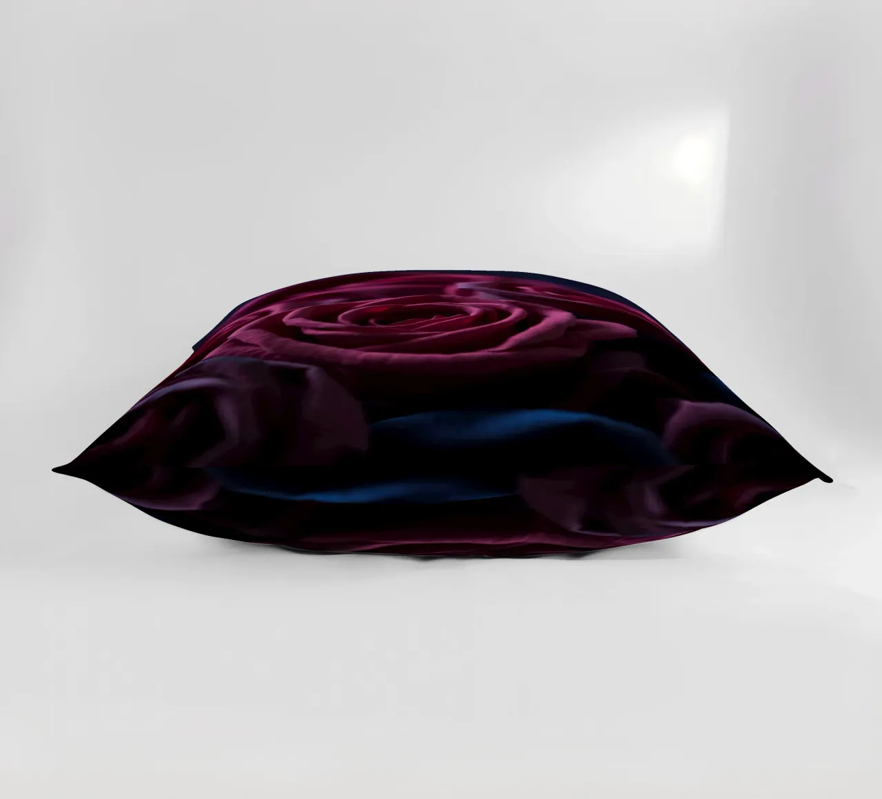Bouquets of deep red roses arranged artfully in low light decorative cushion by DesignDoodle