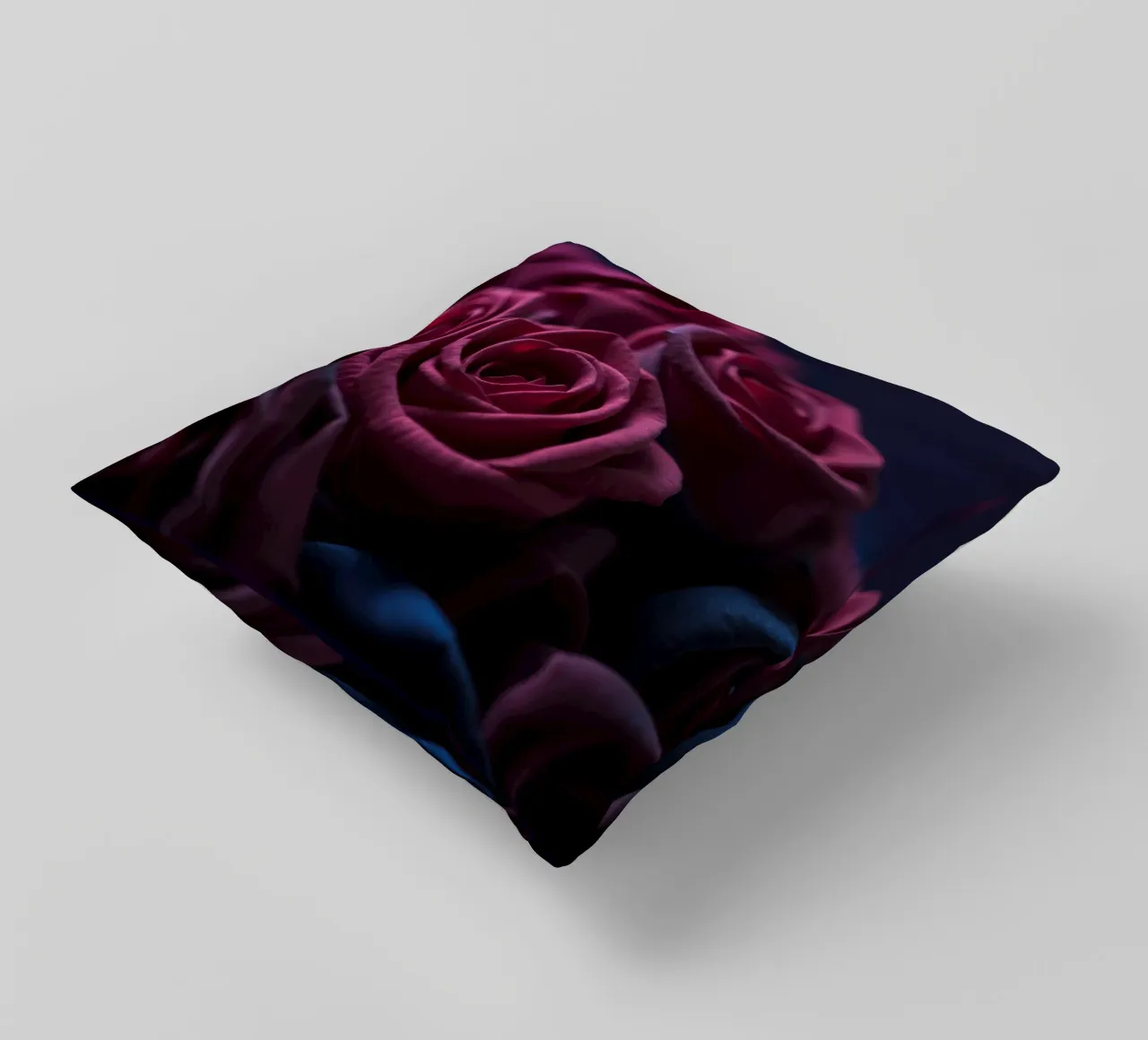 Bouquets of deep red roses arranged artfully in low light decorative cushion by DesignDoodle