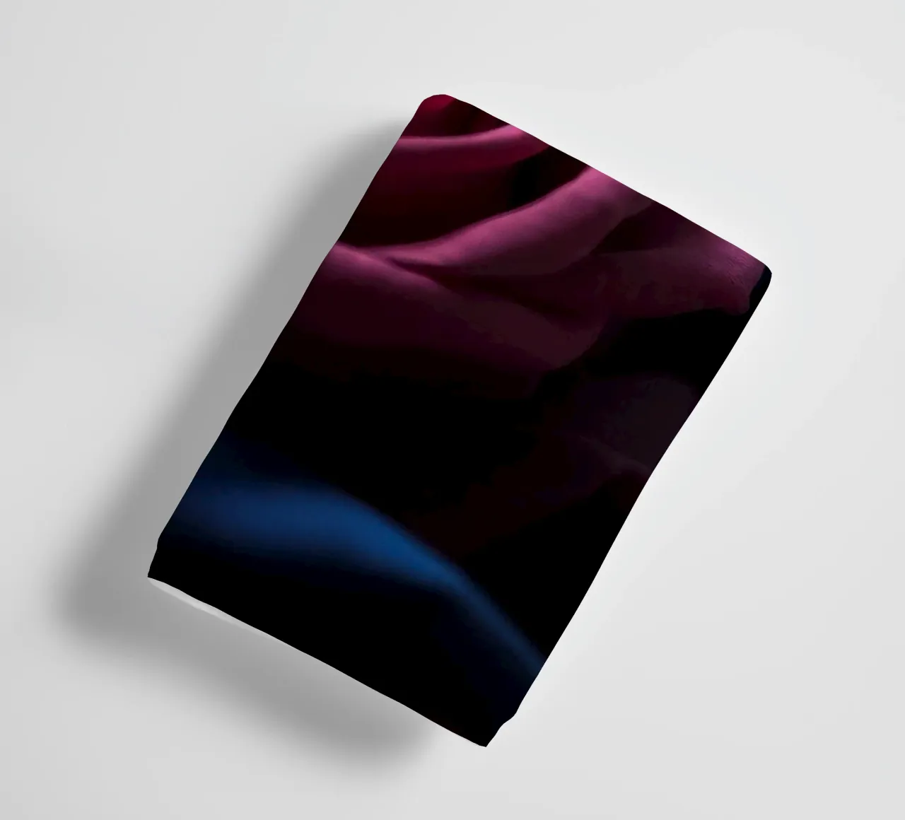 Bouquets of deep red roses arranged artfully in low light towel by DesignDoodle