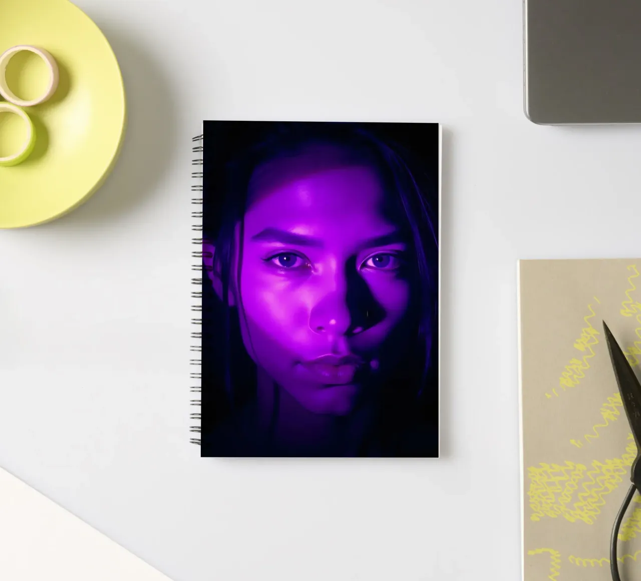 Striking portrait with purple lighting highlighting facial spiral notebook by DesignDoodle