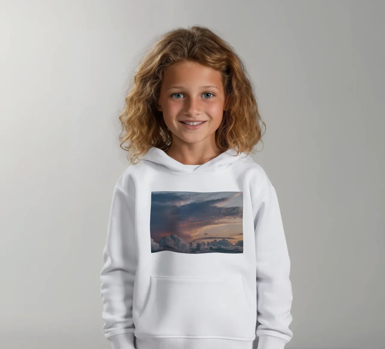 Vibrant sunset over layered clouds in a peaceful sky at dusk kids hoodie by DesignDoodle