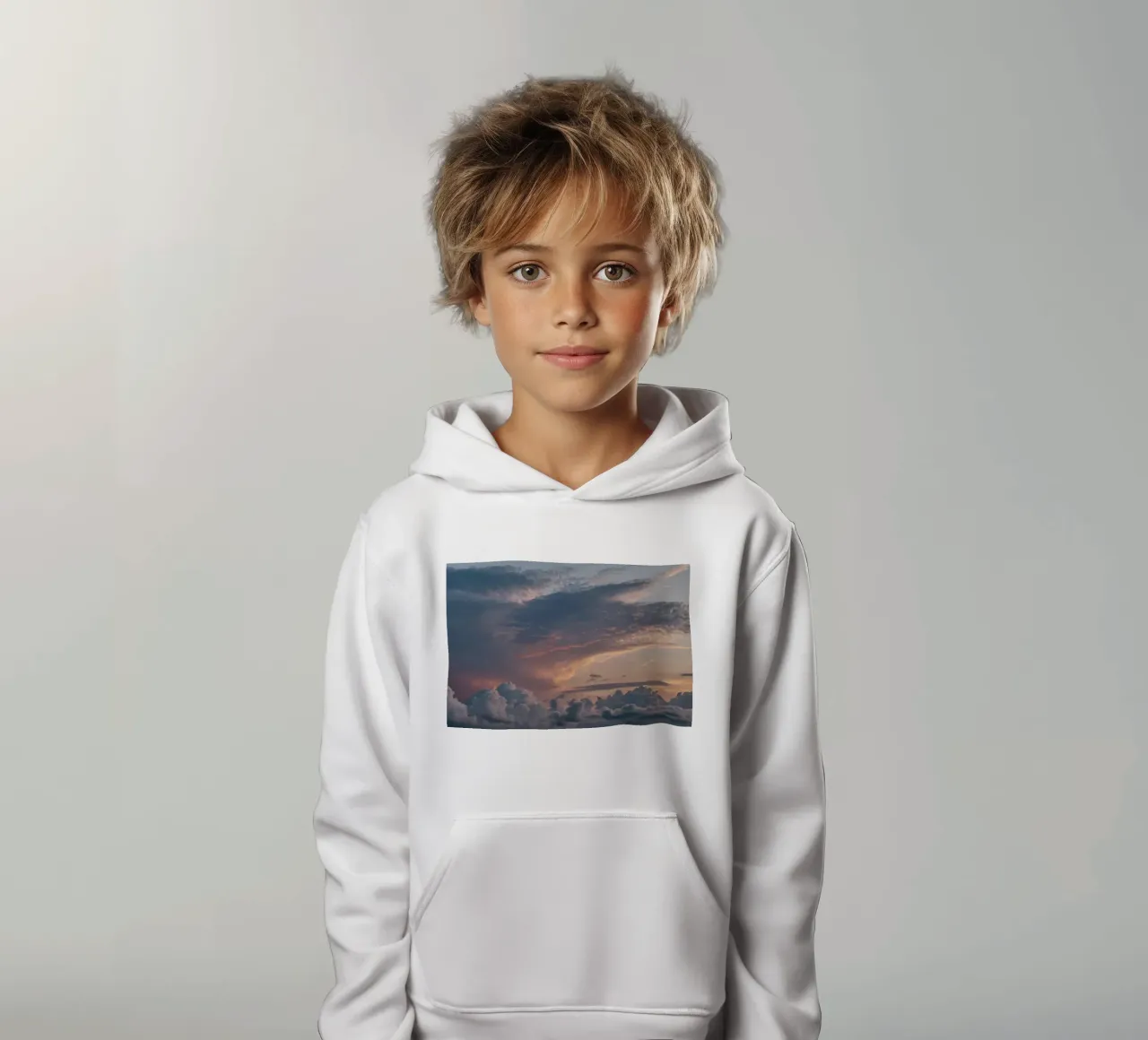 Vibrant sunset over layered clouds in a peaceful sky at dusk kids hoodie by DesignDoodle
