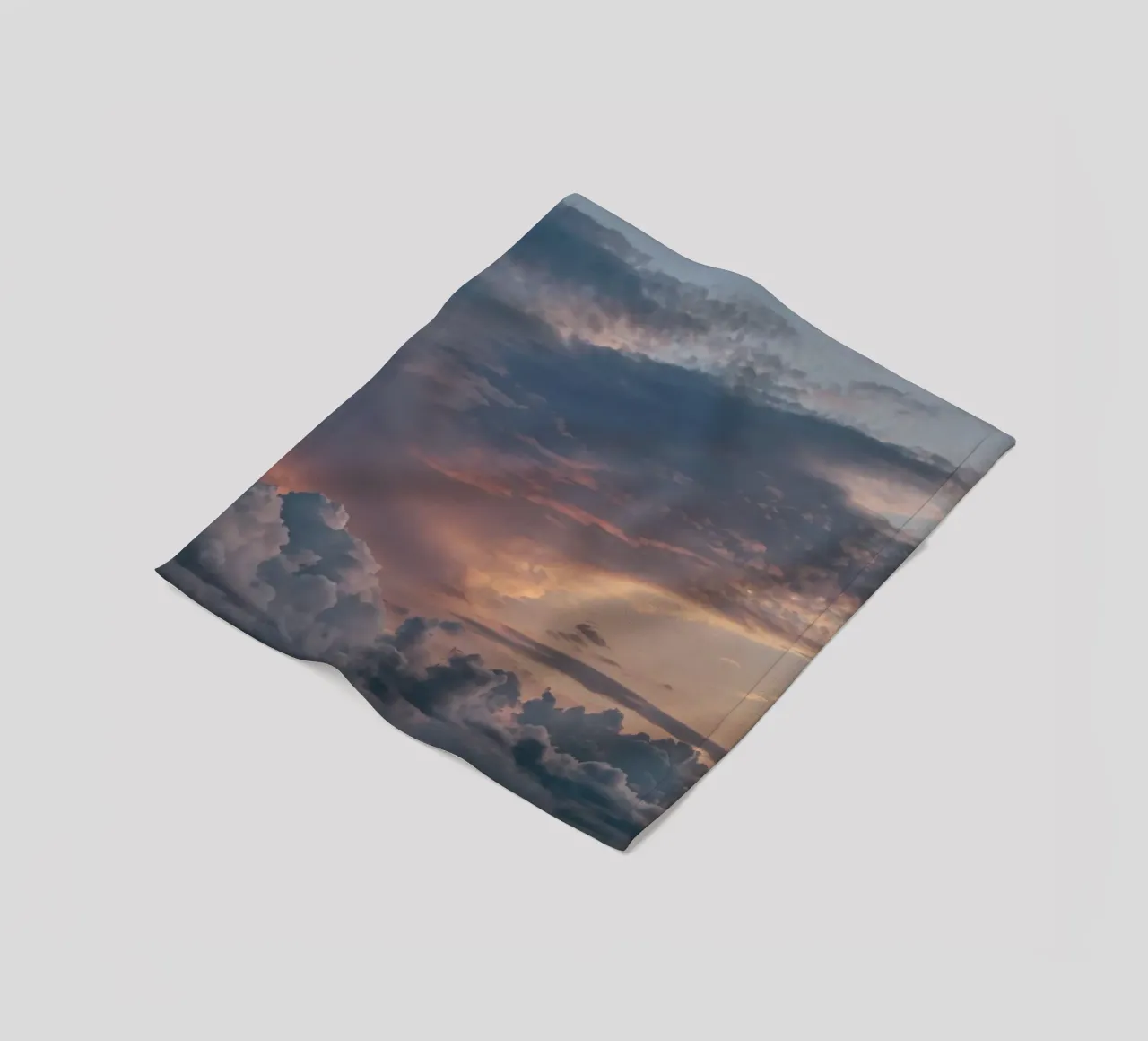 Vibrant sunset over layered clouds in a peaceful sky at dusk fleece blanket by DesignDoodle