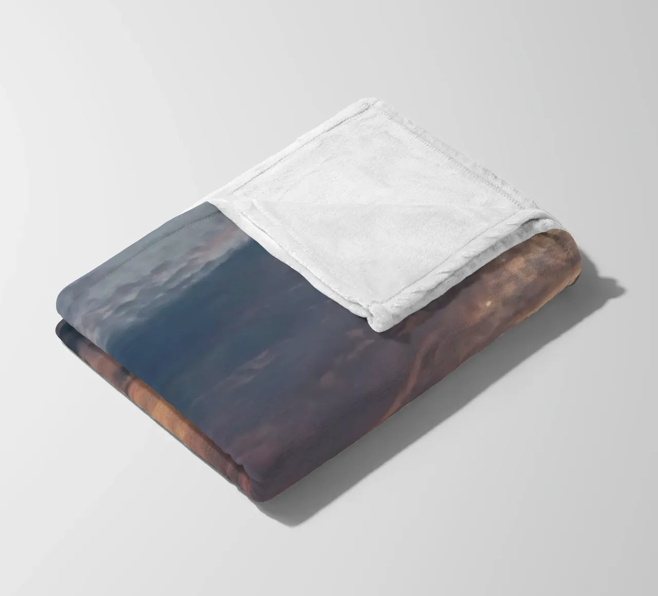 Vibrant sunset over layered clouds in a peaceful sky at dusk fleece blanket by DesignDoodle