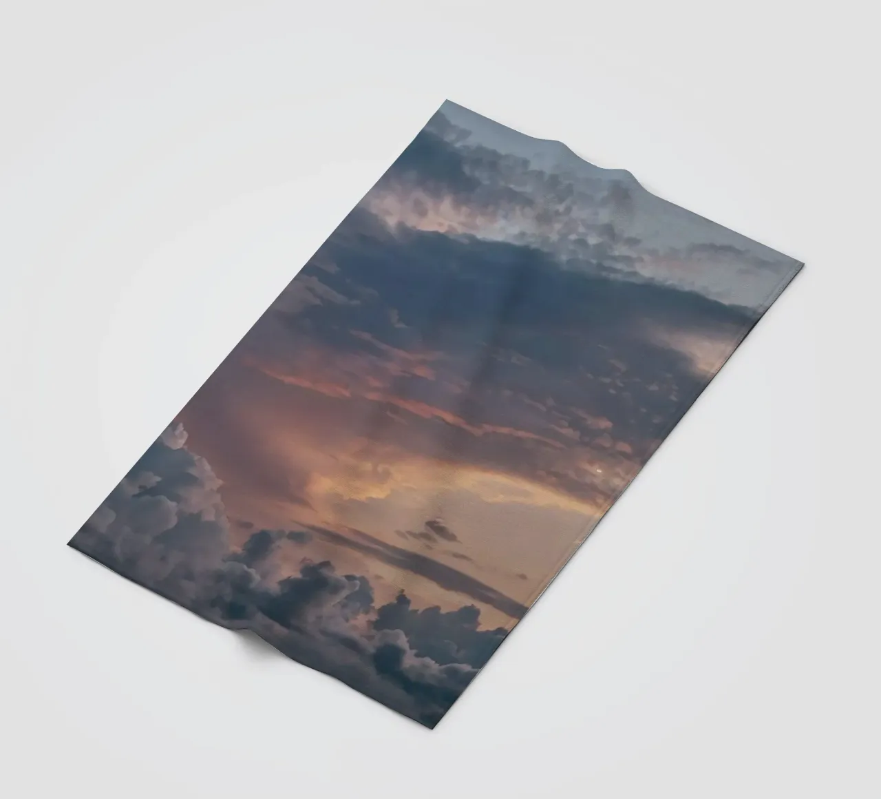 Vibrant sunset over layered clouds in a peaceful sky at dusk fleece blanket by DesignDoodle