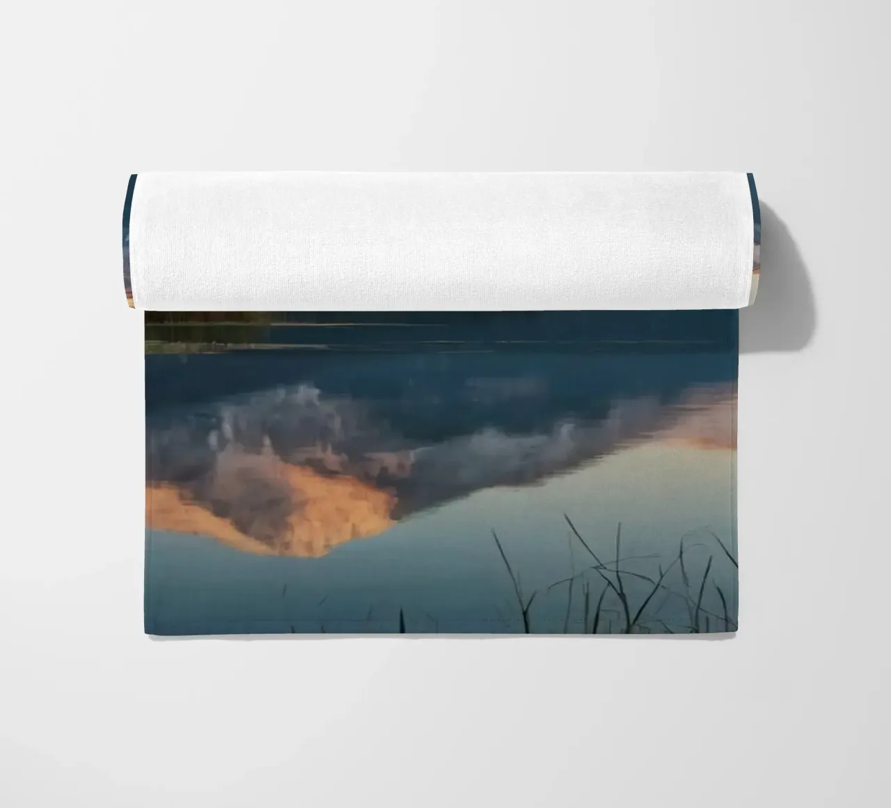 Reflections of majestic mountains at twilight over a lake beach towel by DesignDoodle