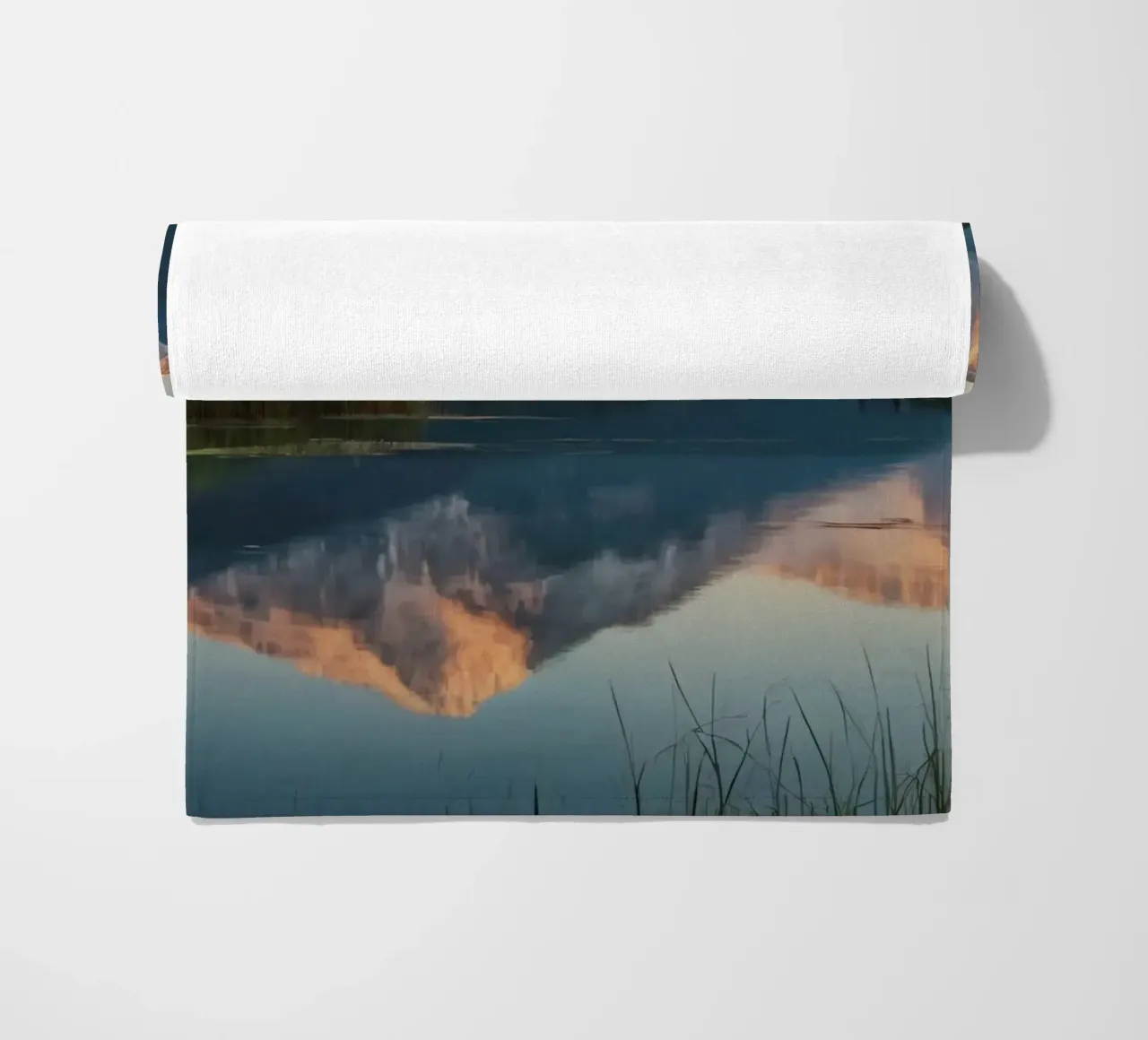 Reflections of majestic mountains at twilight over a lake beach towel by DesignDoodle