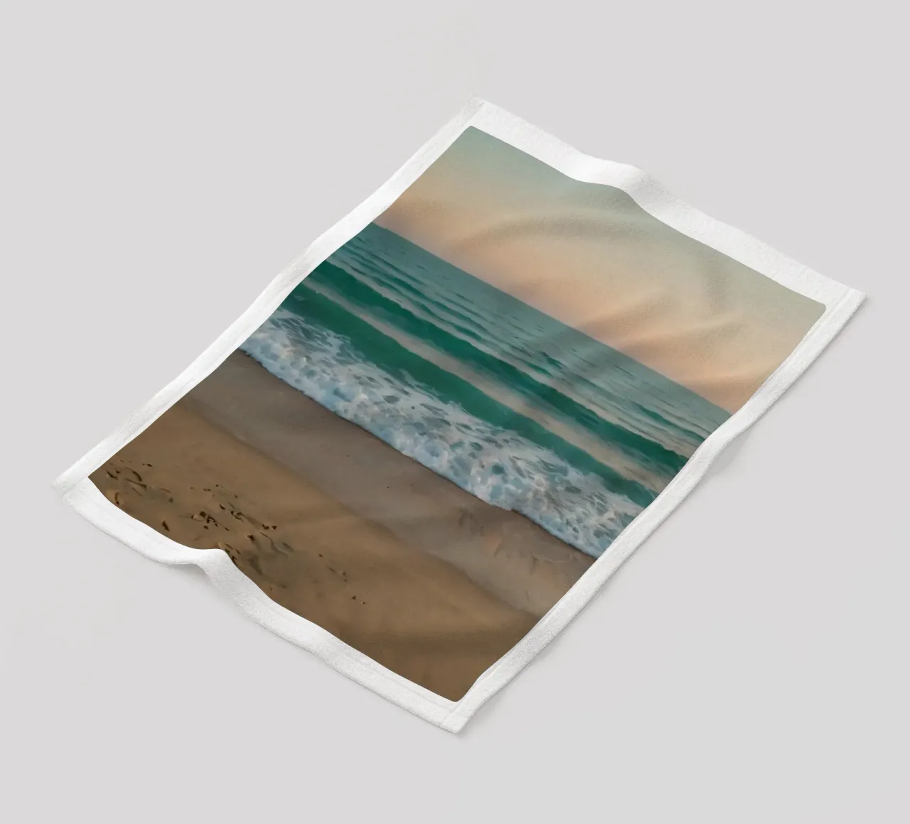 Soft waves lap against golden sand under a colorful sky fleece blanket by DesignDoodle