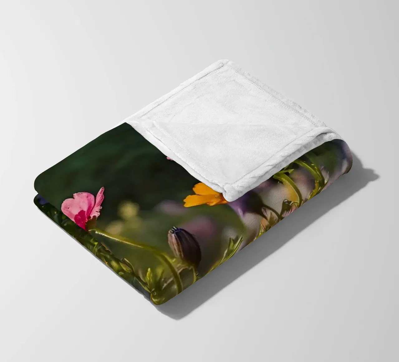 Colorful wildflowers in a sunlit garden during late spring fleece blanket by DesignDoodle