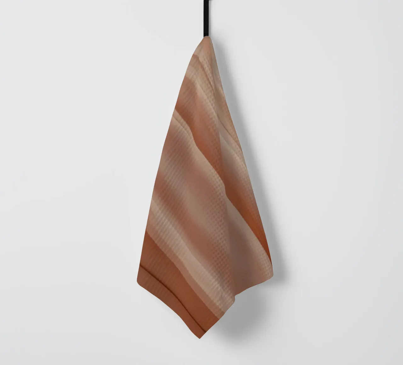 Zachte perzikkleurige stof drapeert elegant in natuurlijk licht theedoek van DesignDoodle