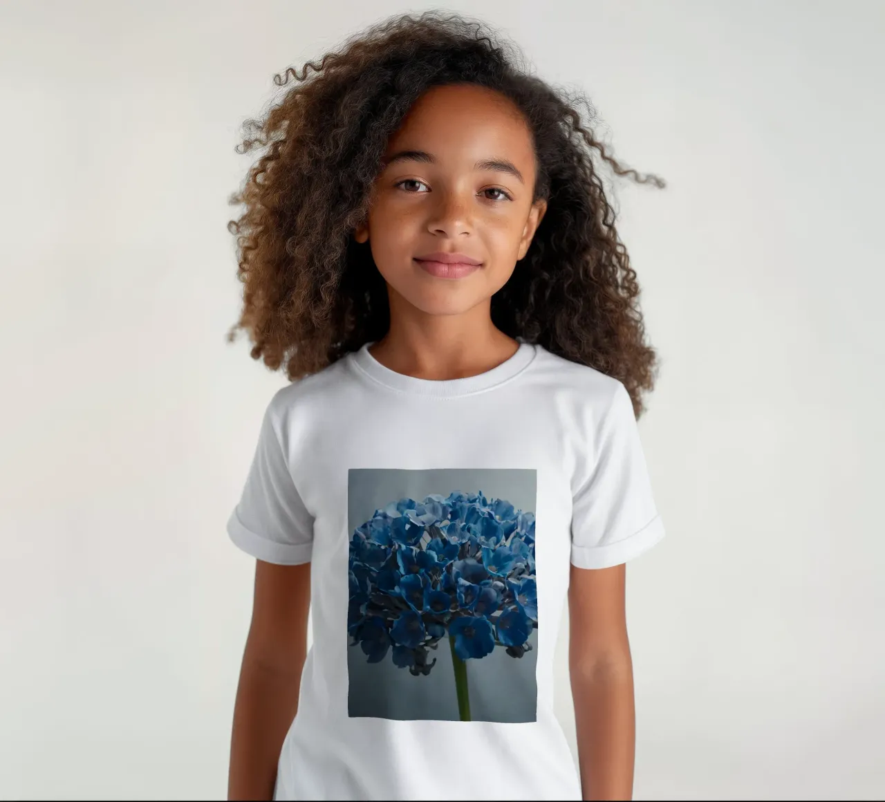 Bright blue hydrangea blooms against a textured background kids t-shirt by DesignDoodle