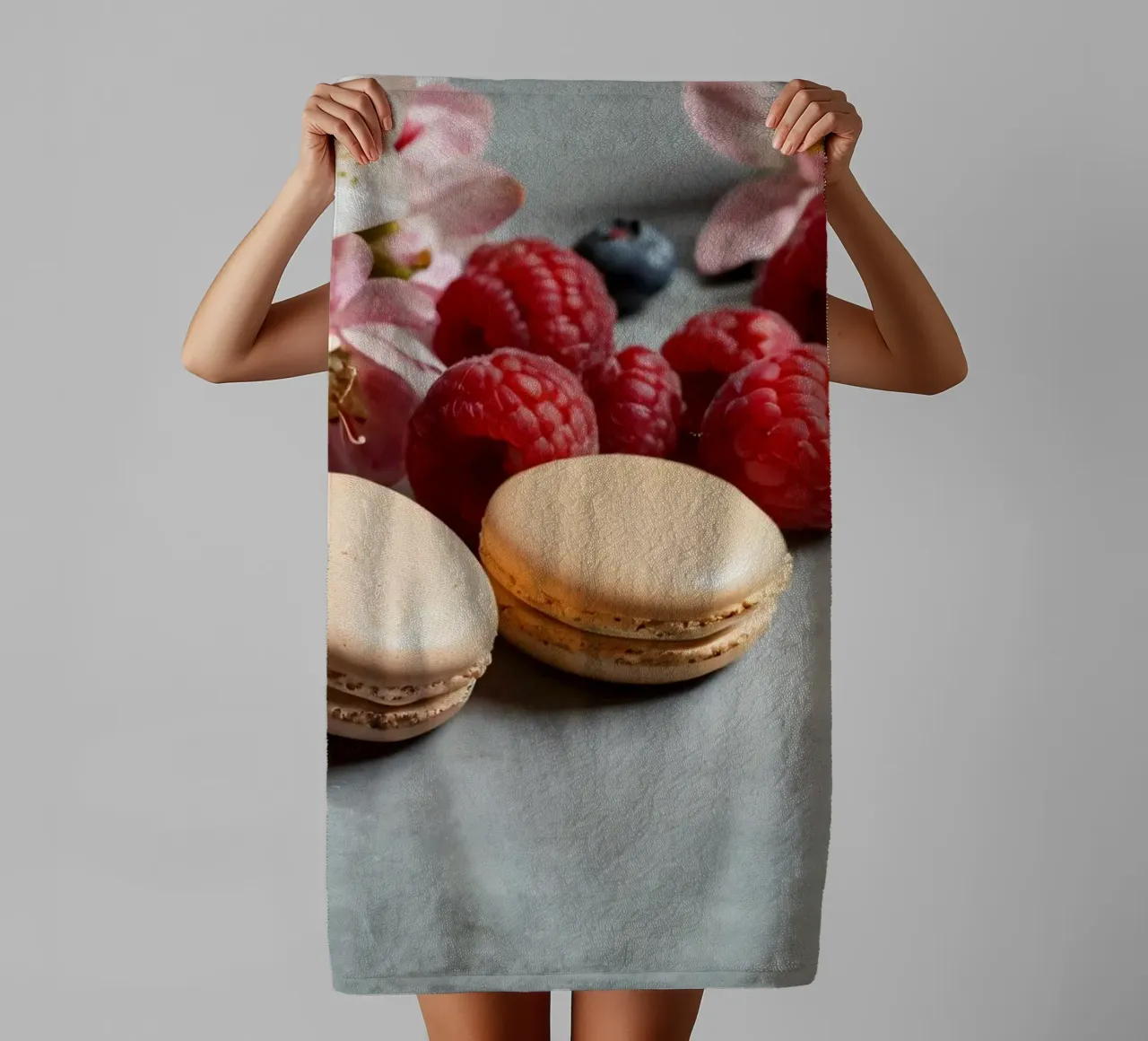 Freshly made macarons surrounded by vibrant berries towel by DesignDoodle