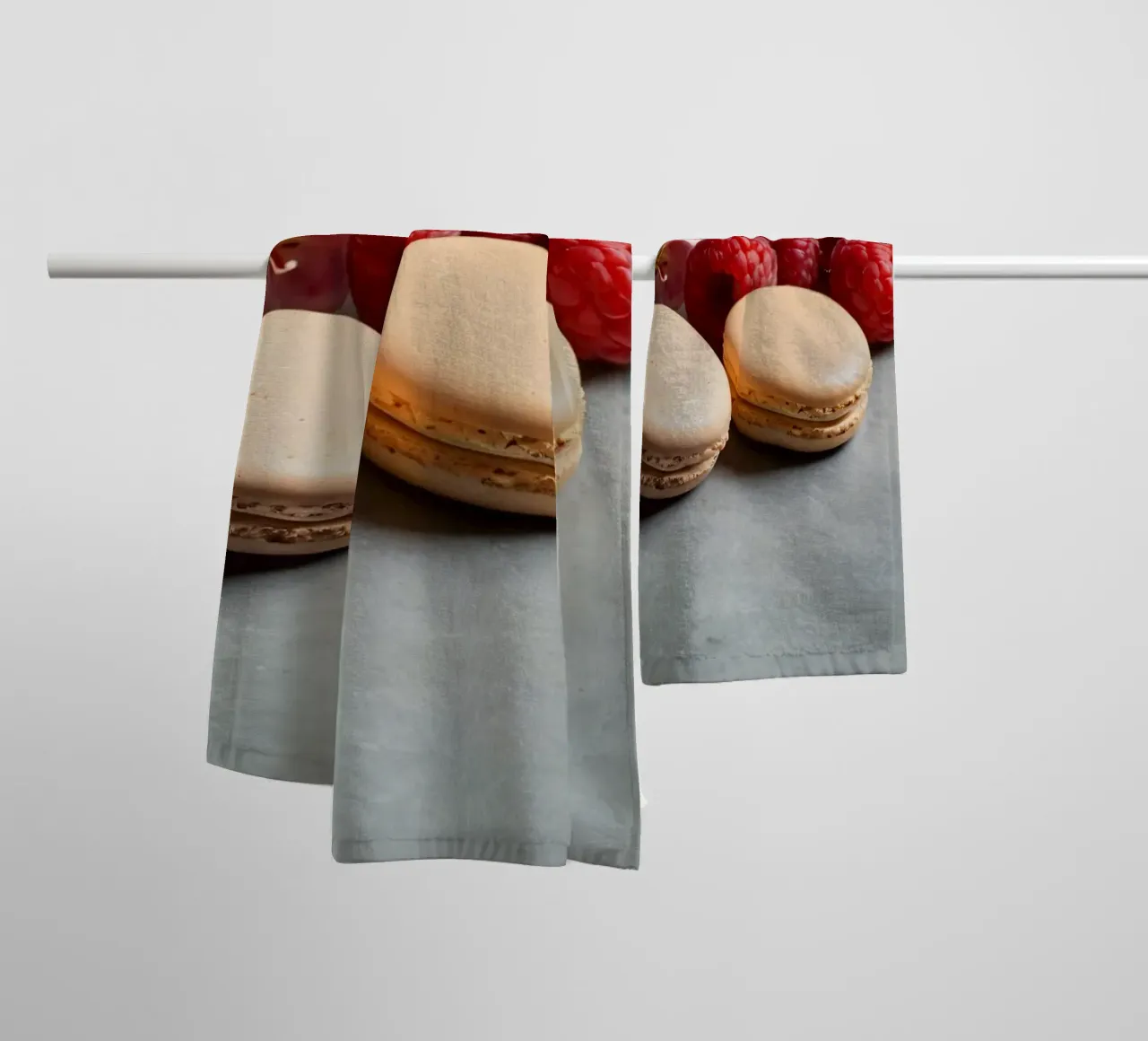 Freshly made macarons surrounded by vibrant berries towel by DesignDoodle