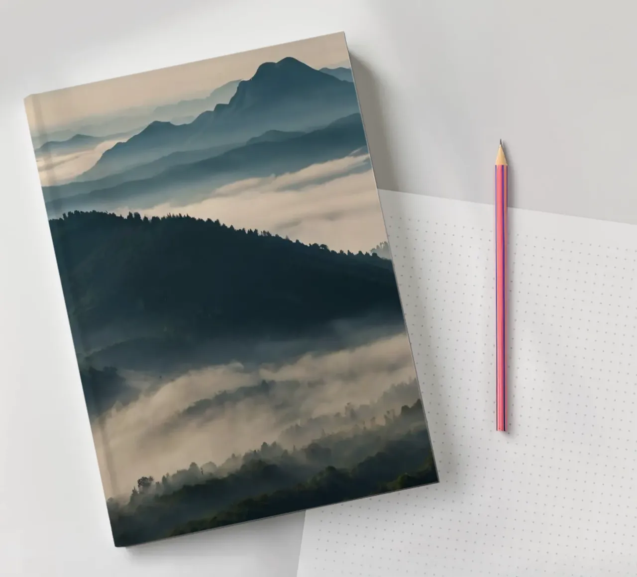 Majestic mountain range shrouded in mist notebook by DesignDoodle