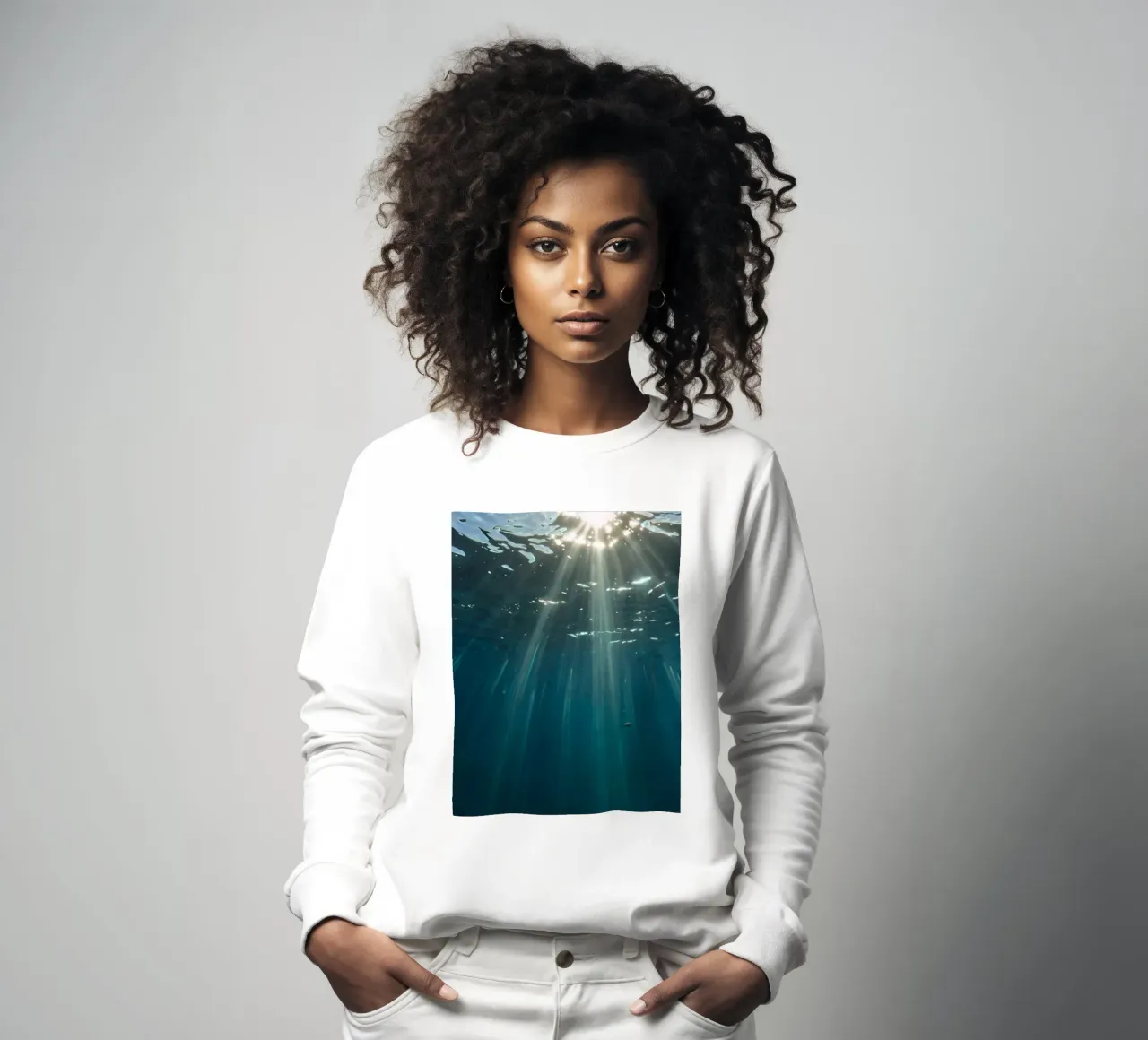 Rays of sunlight penetrate clear water creating sweatshirt by DesignDoodle