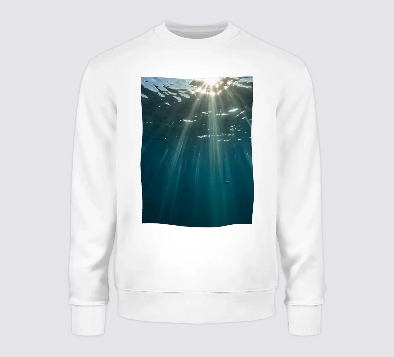 Rays of sunlight penetrate clear water creating sweatshirt by DesignDoodle
