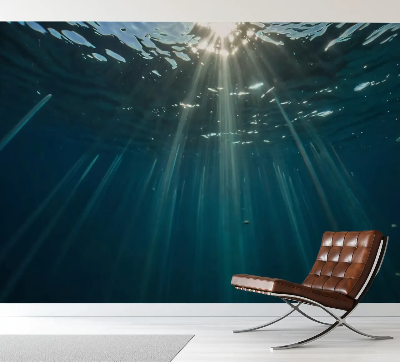 Rays of sunlight penetrate clear water creating photo wallpaper by DesignDoodle