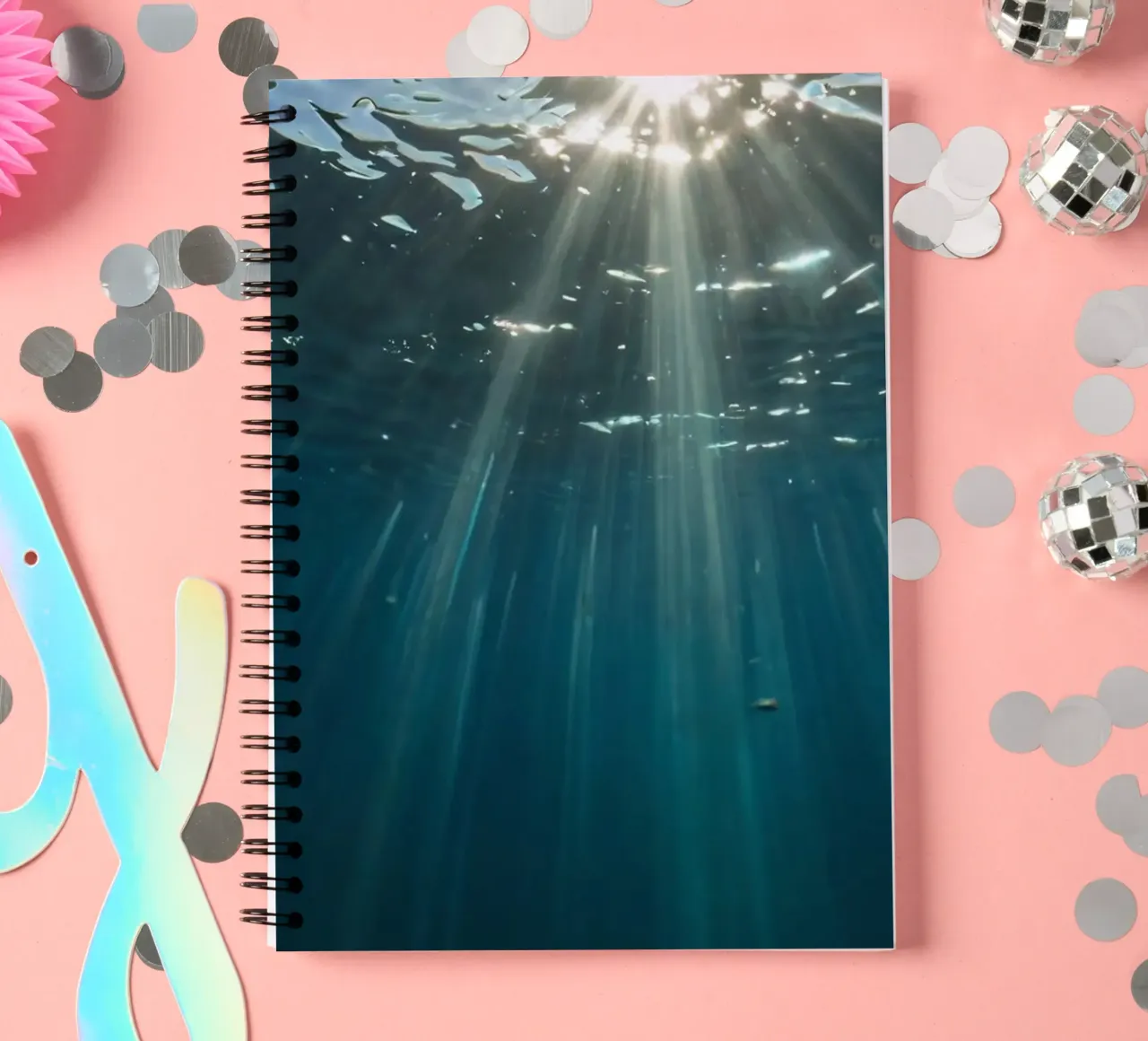Rays of sunlight penetrate clear water creating spiral notebook by DesignDoodle