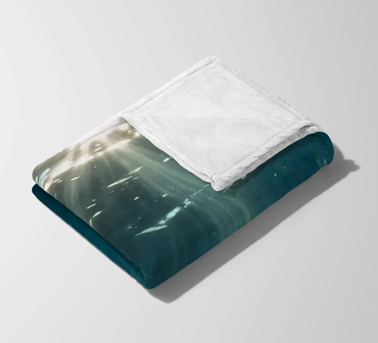 Rays of sunlight penetrate clear water creating fleece blanket by DesignDoodle