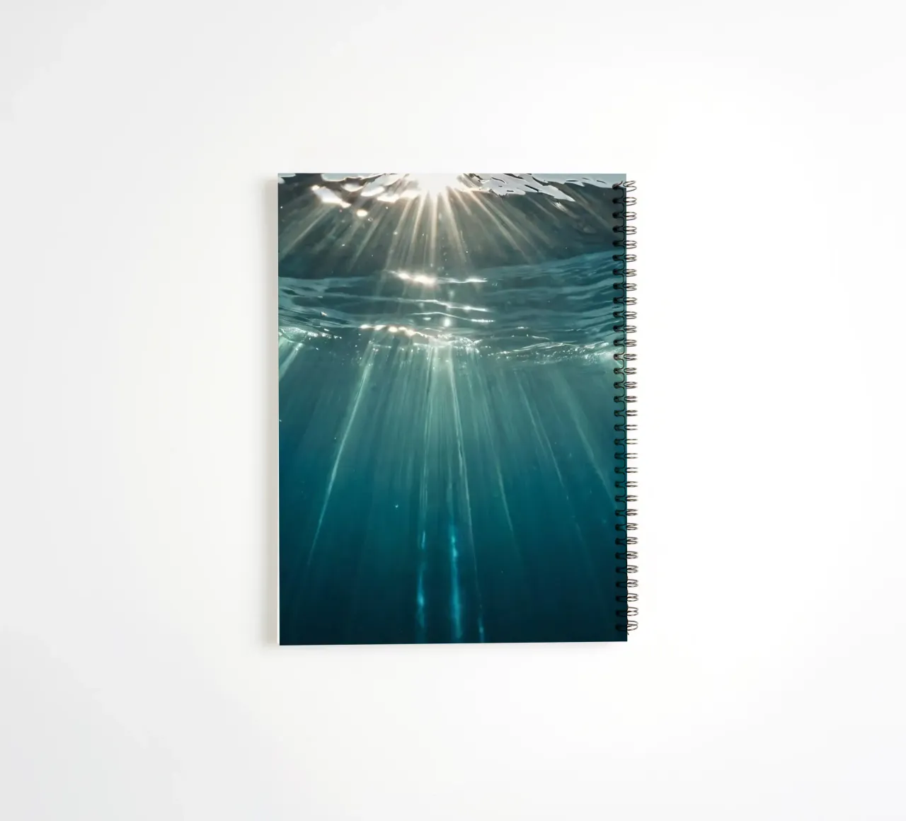 Sunlight streams through clear water mesmerizing pattern spiral notebook by DesignDoodle