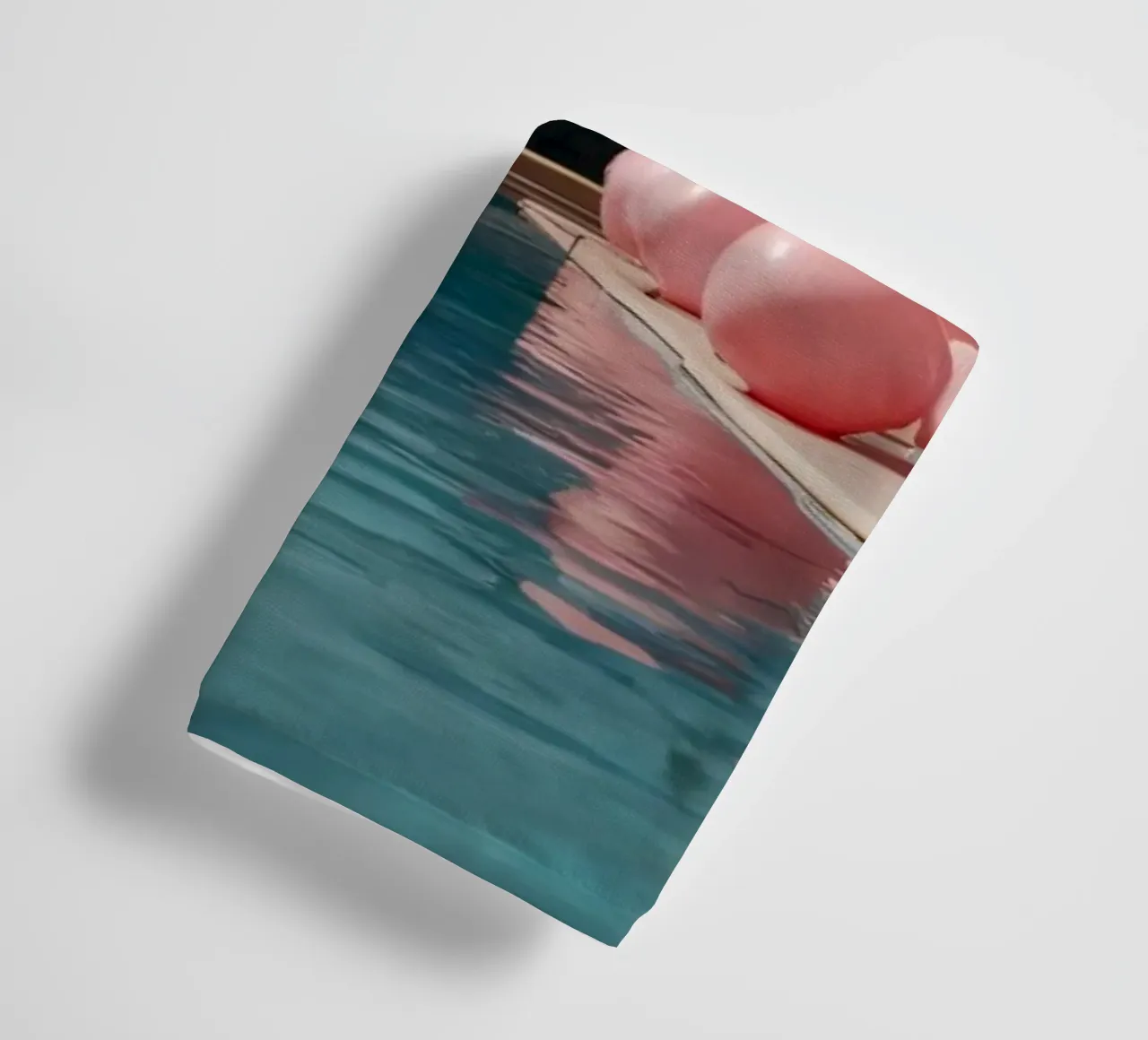 A serene poolside adorned with pink balloons and palm trees towel by DesignDoodle