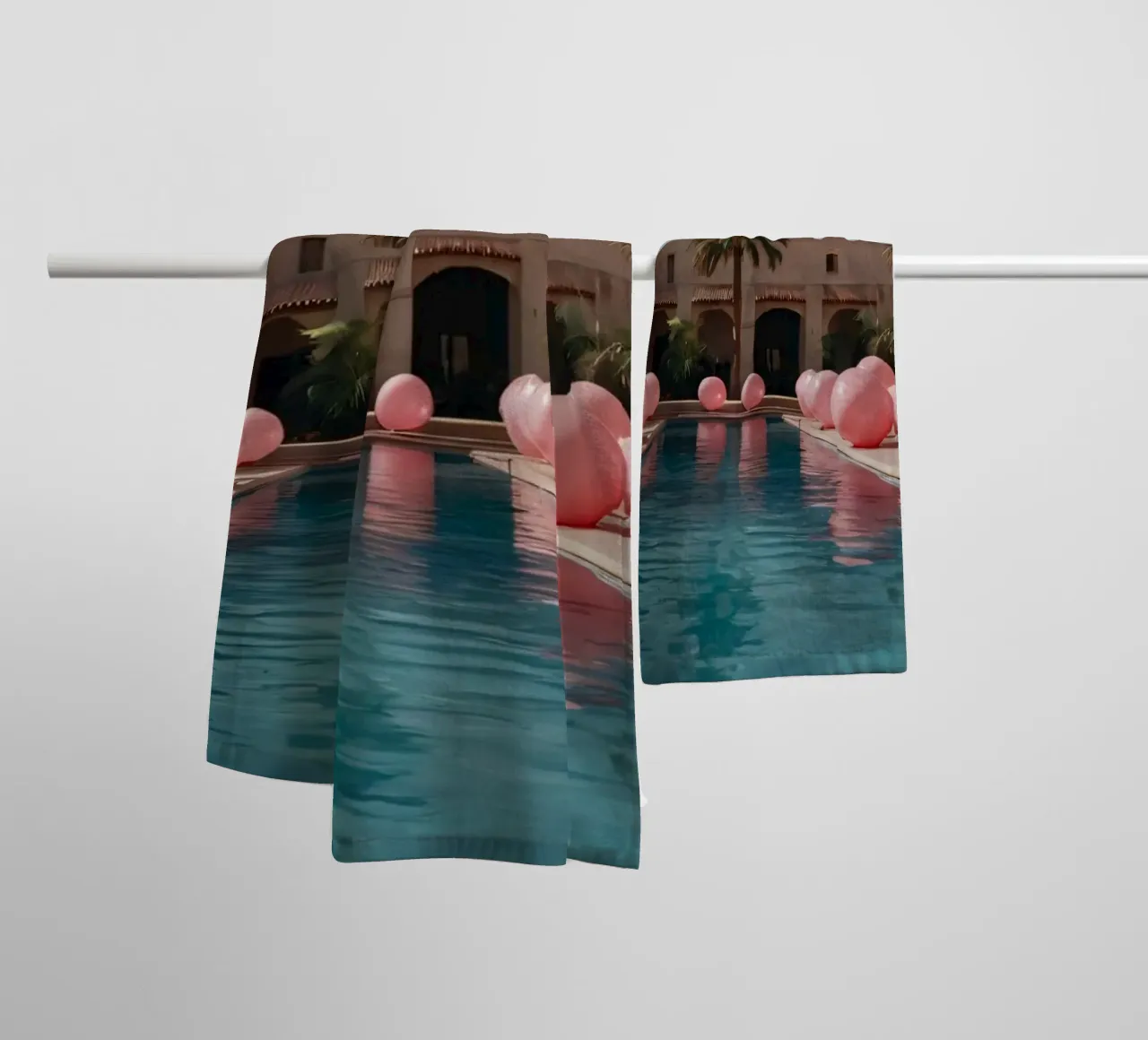 A serene poolside adorned with pink balloons and palm trees towel by DesignDoodle