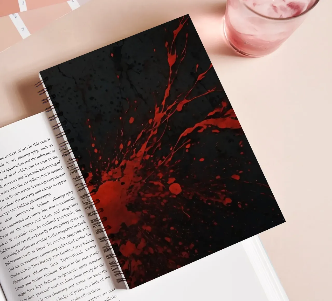 Bold red paint splatters on a dark textured background spiral notebook by DesignDoodle