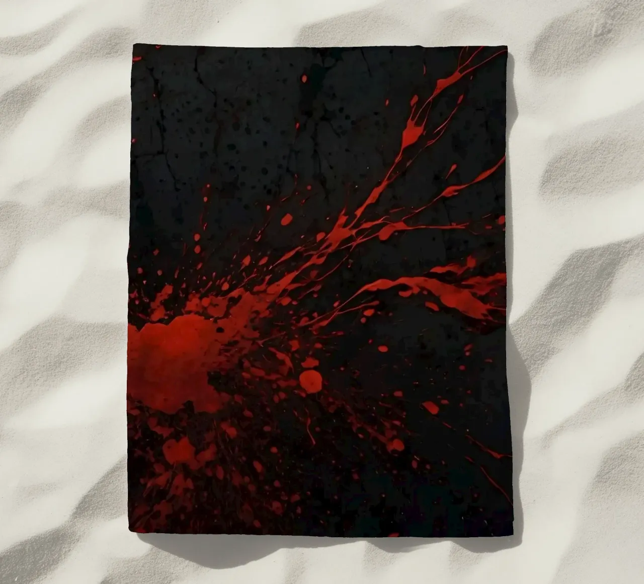 Bold red paint splatters on a dark textured background beach towel by DesignDoodle