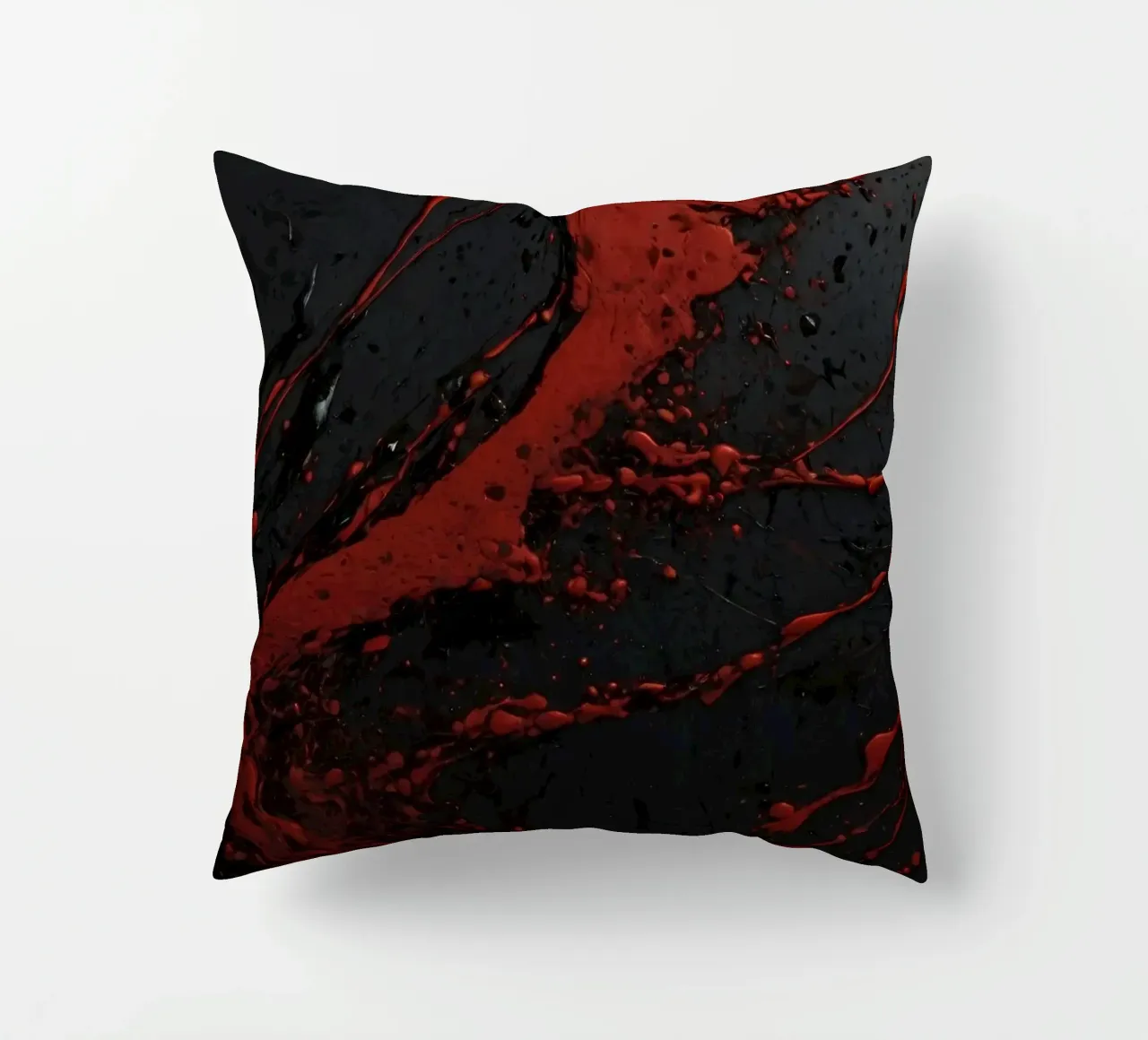 Schizzi astratti di vernice rossa su una superficie nera cuscino da DesignDoodle