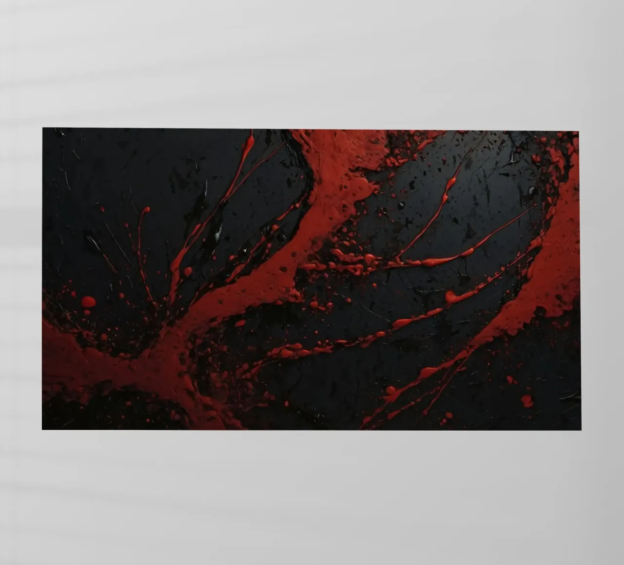 Abstract red paint splatters on a black surface backlit film by DesignDoodle