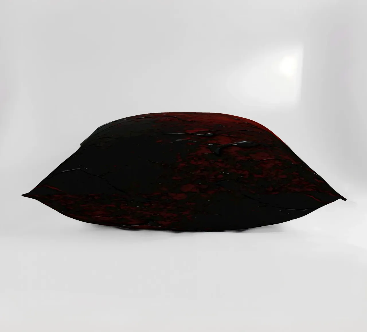 Texture astratta con spruzzi di vernice nera e rossa su un cuscino da DesignDoodle