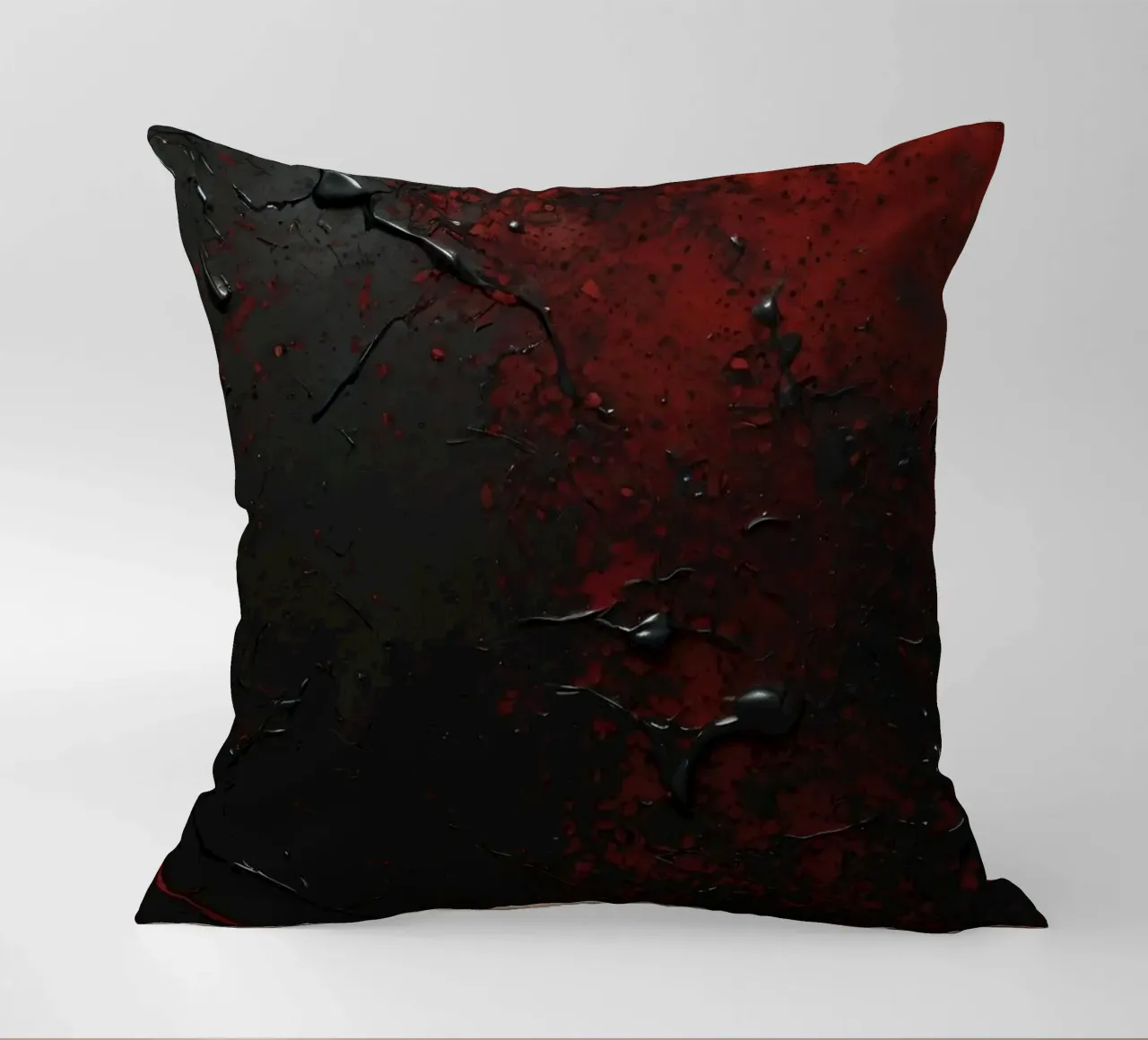 Texture astratta con spruzzi di vernice nera e rossa su un cuscino da DesignDoodle