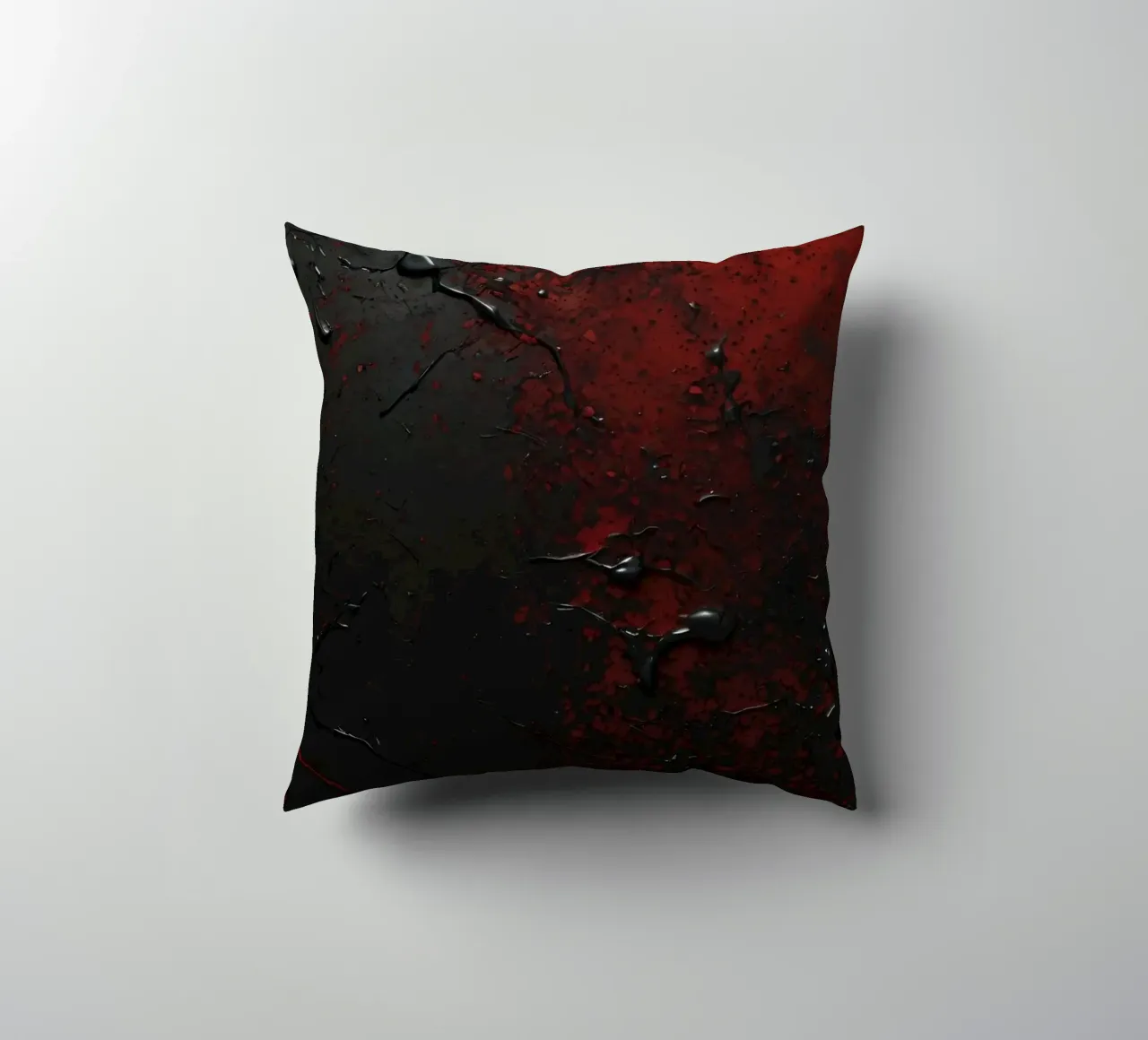 Texture astratta con spruzzi di vernice nera e rossa su un cuscino da DesignDoodle